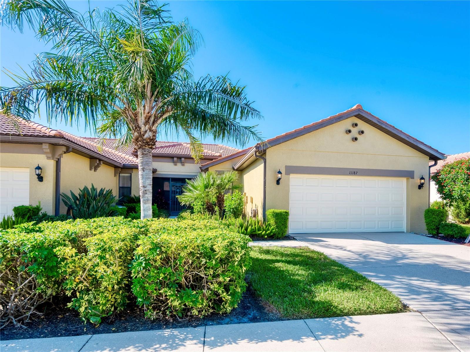 Enjoy serene lake views from this light-filled 2-bedroom plus den garden villa in the premier 55+ resort-style community of Venetian Falls! This desirable end-unit Bella Vista model offers abundant natural light through numerous windows and a peaceful lake backdrop to admire from the screened lanai, perfect for bird watching and relaxing. Move-in ready, the home features a freshly painted interior, skylights, crown molding, enhanced baseboards, new bedroom carpet, and hurricane shutters for peace of mind. The kitchen blends style and function with quartz countertops, wood cabinetry, a pantry, stainless steel appliances, a dining bar, and a cozy breakfast nook overlooking the front garden. The spacious primary suite includes two closets (one a large walk-in), a generous bedroom, and an ensuite bath with updated shower, dual sink vanity, and linen closet. A guest bedroom, guest bath, and a flexible den with a door—ideal as an office or hobby room—plus a laundry room, complete the layout. The HOA fee covers maintenance-free lawn care, internet, basic cable, and scheduled exterior services such as roof power washing, painting, and mulching. Residents enjoy an exceptional clubhouse and amenities, including a heated lap pool, spa, resistance walking pool, fitness center, billiards, arts-and-crafts room, bocce ball courts, and a full calendar of activities coordinated by an on-site lifestyle director. All of this is located just minutes from the Gulf beaches, shopping, dining, and historic Main Street Venice. Don’t miss this beautiful, move-in-ready home in Venetian Falls!