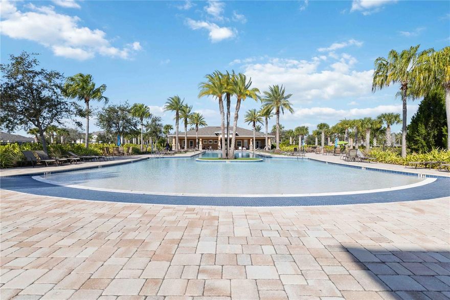 Welcome to this charming and highly sought-after Sandbar 2 townhome by Mattamy Homes, located in the desirable community of Harmony at Lakewood Ranch. This thoughtfully designed residence offers 3 bedrooms plus a loft, 2.5 baths, and an additional 12' x 10' storage room, providing a potential for a 4th bedroom, home office, game room, or flex space.

Upon entry, soaring vaulted ceilings reaching up to 15 feet immediately enhance the open-concept layout, creating a bright and airy living environment. The home features carefully selected finishes throughout, including quartz countertops, laminate flooring, 8-foot interior doors, and 7" x 22" wood-look tile on the main level.

The kitchen blends sophistication and functionality with quartz countertops, tile backsplash, 42" staggered cabinetry, stainless steel appliances, and a striking custom board and batten accent wall. The spacious primary suite offers luxury vinyl flooring, an expansive walk-in closet, and an elegantly finished primary bath featuring dual-sink quartz vanity and a tiled shower.

Upstairs, you’ll find two secondary bedrooms, a full bath, a versatile loft, and the additional 12' x 10' bonus/storage room, ideal for work-from-home needs or additional entertainment space. A 2-car garage completes the home.

Residents of Harmony enjoy resort-style amenities, including a heated pool, outdoor grilling area, fitness center, playground, and pet-friendly walking trails woven throughout the community, making it ideal for active lifestyles and pet owners alike.

Conveniently located near The Green at Lakewood Ranch, you’ll have easy access to popular dining, bakeries, coffee shops, shopping, fitness centers, spa, medical offices.

Schedule your private showing today and experience the best of Lakewood Ranch living.