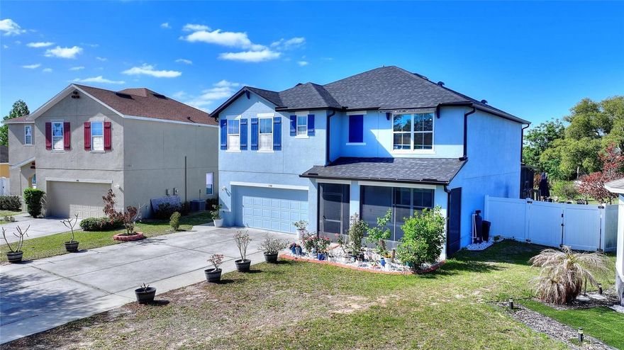 Enjoy Florida living at its finest in this stunning 5-bedroom, 3-bath single-family home situated on a private half-acre lot with gorgeous lake views! This 2,600 sq. ft. Hayden Model offers a bright, modern open-concept layout, perfect for both daily life and entertaining. The spacious updated kitchen flows effortlessly into the family room and dining area, creating a warm and inviting space for gatherings. A highlight of the home is the first-floor bedroom with a full bath—ideal for guests, extended stays, or multigenerational living. Upstairs, you’ll find generously sized secondary bedrooms and a private primary suite with ample closet space and a relaxing en-suite bath, ensuring comfort and privacy for all. Additional features include upgraded kitchens and baths, premium flooring, a water softener, paid-off solar, screened front and back covered patios, and lake access from your private lot. Conveniently close to shopping, dining, and medical facilities, with a low HOA and no CDD—this home is your perfect private oasis!