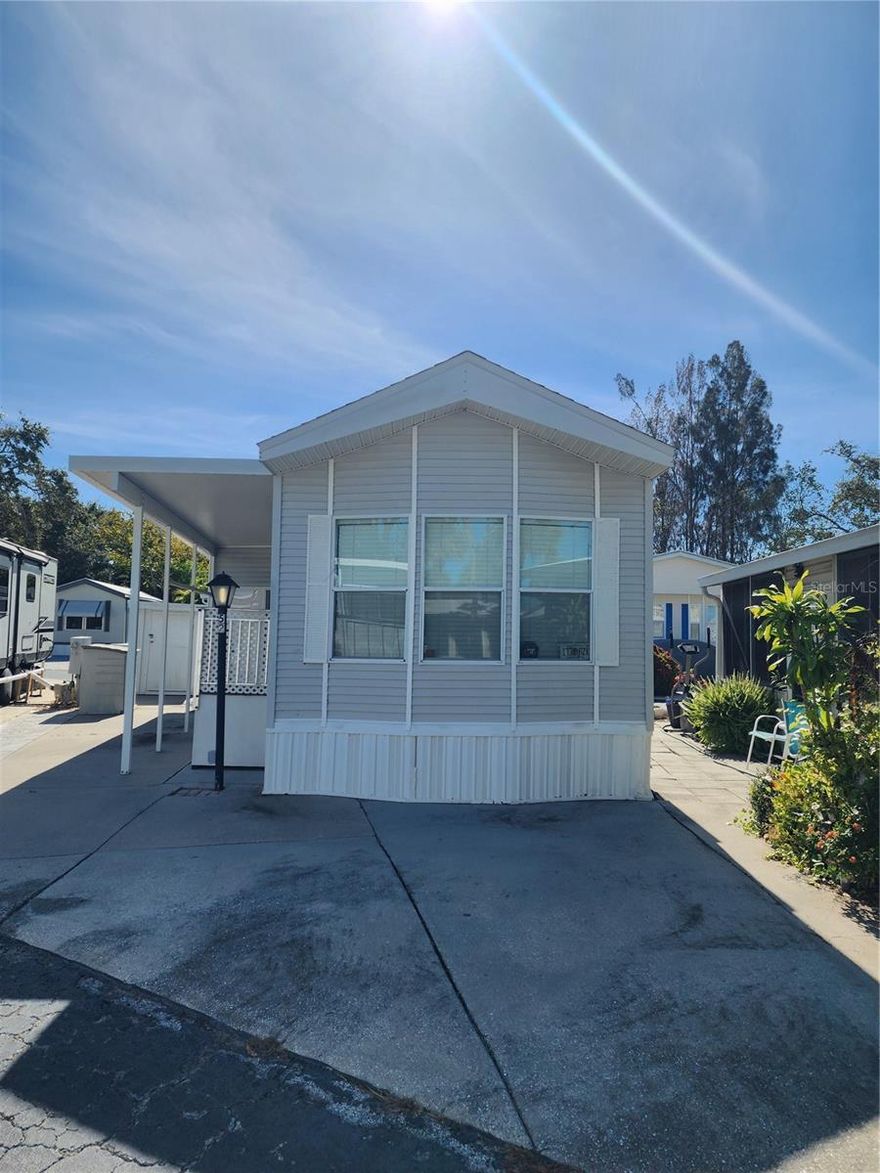 Furnished 1 Bed/ 1 Bath cathedral ceilings, lots of cabinet space. Newer fridge. Laminate flooring. Custom drapes, newer roof, downstairs add-a-room with hurricane windows, air and heat, Futon sofa, cement driveway, and patio area, covered patio area, and much more.