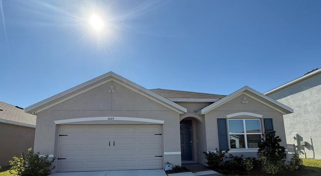 Photo of 6009 Wandering Willow Dr, Wesley Chapel, FL 33545 (MLS # O6363946)