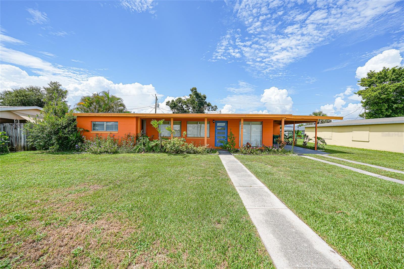 Welcome to this charming, vintage Florida ranch nestled in the established Port Charlotte Sec 004 neighborhood. This delightful 2-bedroom, 1-bath home—complete with a versatile bonus room—offers 965 sq ft of open, light-filled living space on a 0.17-acre lot. Fully refreshed and ready to move in, the home features a NEW roof, NEWER central AC, and updated energy-efficient kitchen appliances. The freshly replaced exterior doors enhance both curb appeal and security. Inside, the open floor plan accentuates natural sunlight streaming through aluminum-framed windows, creating a bright and airy ambiance throughout the living and dining areas. Imagine enjoying your morning coffee or relaxing evenings on the cozy front porch. The adjoining bonus room (14×10) offers flexible space ideal for a home office, den, hobby room, or guest retreat. Practical touches include a separate laundry room with outdoor access and durable tile flooring that flows through the home. Outside, a roomy backyard and a convenient storage structure provide ample room for gardening enthusiasts or weekend projects. A one-car covered carport ensures dry entry throughout the year. Built in 1958 on a sturdy slab and block construction, this home has been thoughtfully updated with a blend of classic Florida charm and modern comforts. Perfect for first-time buyers, those downsizing, or investors, the home is just minutes from schools, shopping, and the beautiful Gulf beaches