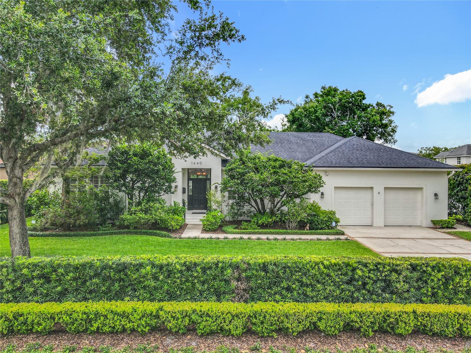 This elegant one story home is located in highly desirable Winter Park on an oversized .28 acre lot with mature and lush landscaping and NO HOA. It has 10' ceilings and an open floor plan combining kitchen, dining, and living rooms with gorgeous wood floors and plenty of natural light overlooking the secluded & screened salt water pool with cascading water features, gas heated spa, and covered lanai. This home has a warm and welcoming atmosphere perfect for entertaining family & friends. The gourmet kitchen features an induction cook top, built in convection & microwave oven, stainless steel refrigerator, vented stainless steel hood system, wine refrigerator, bar station, and pantry. It also has custom designed kitchen cabinetry with abundant storage and pull out shelving plus a big island with designer pendant lights and eat in area for a large table and chairs. The laundry room next to the master bedroom has cabinetry and a sink. Adjacent to the living room is a room that could be used as a office or workout room AND a big multi functional room with half bathroom also overlooking the pool area. Sliders from the living room and the multi functional room are pocket sliders which really open up the home in cooler weather ! The huge master suite also opens to the pool and has his and hers walk in closets with built in custom closet organizers and the master bathroom has dual sinks, whirlpool garden tub, and big walk in shower. In addition, there are two guest bedrooms that share a hall bathroom. The backyard is fenced and very private and peaceful with a gravel walkway with low voltage lighting that leads to an arbor with a swing for an outdoor gathering or reflection. Other upgrades includes Plantation shutters, motorized shades on sliding doors, whole house built in audio system, and security system. Roof was installed in 2019 and new pool pump. Steps away is Phelps Park with playground, tennis and pickleball courts and the YMCA is nearby. Park Avenue and Downtown Winter Park with plenty of fine dining and upscale shopping options are a bike ride away or short drive !