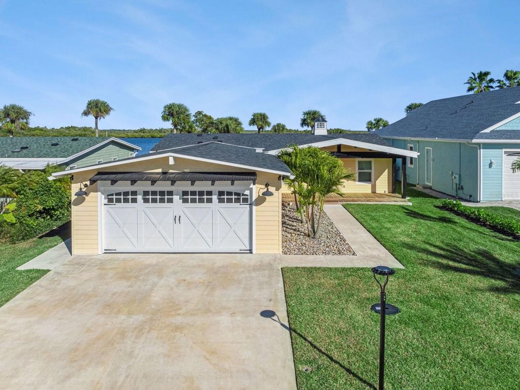 Photo of 341 Marsh Landing Loop, Oak Hill, FL 32759 (MLS # O6378217)