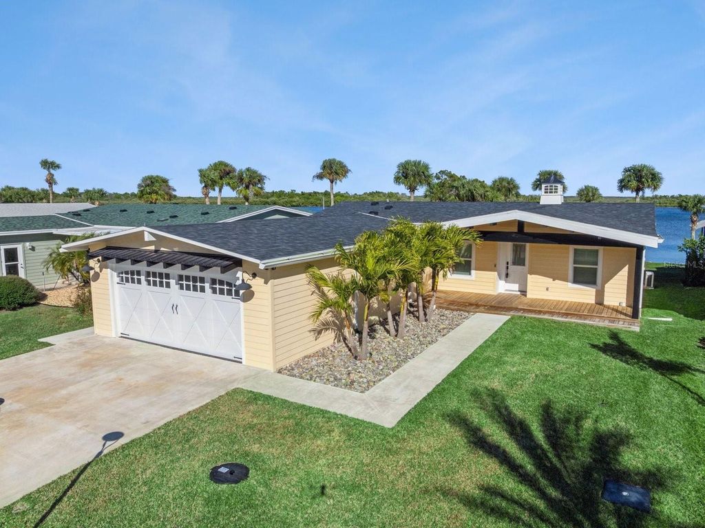 Photo of 341 Marsh Landing Loop, Oak Hill, FL 32759 (MLS # O6378217)