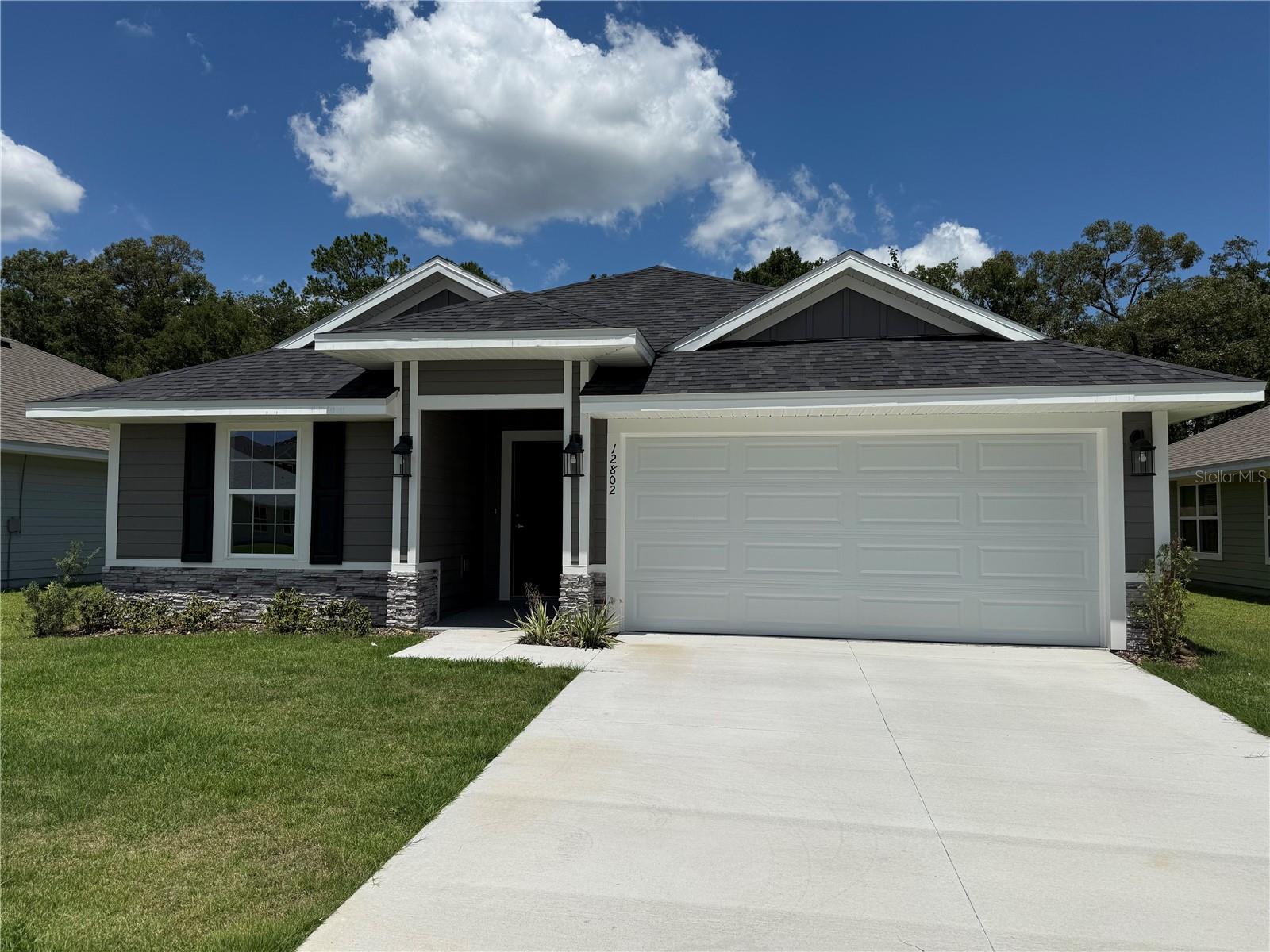 Seller concessions include a special finance rate of 4.99%. The rate applies to builders' preferred lender, Acrisure Mortgage, which utilizes FHA, VA, USDA, conventional loans, or up to $20,000 towards closing costs. SAVANNAH STATION A, FL, is a quiet, country-like area close to all your shopping needs—Three-bedroom, two-bath MOVE IN READY, 1512 SQFT. LOT 258 has hardy siding, stacked stone accents on the exterior, and a large front porch. Great location close to Gainesville, Alachua, and Lake City. It features LVP in the wet areas and throughout the main home, excluding the bedrooms, dining room, family room, and a leading area out to the backyard with a new fence. The spacious primary suite features a double-door closet, a granite double-sink vanity, a walk-in shower, and a garden Tub. The kitchen area features a large granite island that overlooks the Family room. This prominent kitchen features upgraded cabinets, granite countertops, a stainless steel Frigidaire appliance, a range, a dishwasher, a microwave, and a disposal. Brushed Nickel Faucets, LED lighting, and a Built-in pest defense system. Energy-efficient HVAC system. Taxes are based solely on land taxes. Prices are subject to change without notice.