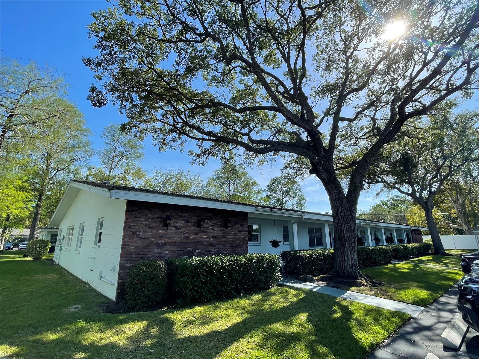 This well maintained condo is located in a quiet 55+ community, nestled among mature oak trees and lush green grass. Just three miles from the beach, this Florida condo is perfect for someone whom wants to feel connected with all the best things Florida has to offer. Located near a bus route, and convenient to shopping and restaurants, this property is all about location, location, location. Stepping inside you'll notice that this end unit is blessed with an abundance of natural light that pours through impact resistant, energy efficient windows. The great room is expansive and provides an area for a dining table, with plenty of extra space to entertain. The bedrooms don't leave much to desire, featuring large walk in closets in each, and a spacious room size that is able to accommodate large furniture while still having plenty of space to move around. Consider making this quite home nestled among mighty oaks your dream condo.
