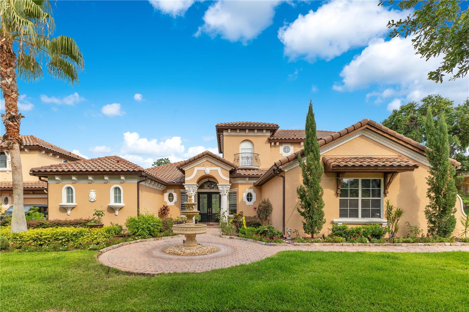 Discover a home where luxury meets convenience, perfectly crafted for today's way of life. Welcome to 1438 Belfiore Way, a Luxury Single family home located in the distinguished Gated community of Tuscany Ridge in desirable city of Windermere, Florida. This beautiful home is a move-in-ready gem, modern, elegant and comfortable. Situated on a private lot at the end of the road, with no rear neighbors and only one neighbor on the side. It features numerous upgrades and extras, including crown molding, tile floors, vertical blinds, security cameras, and more. On the first floor, you’ll find a Spacious Primary Suite with a peaceful view of the pool, a generous walk-in closets, and a luxurious en-suite bathroom with elegant finishes. A guest bedroom with guest bathroom with access to the pool area, a dedicated home office with french doors, a formal living room, dining room, a wet bar, a stunning custom kitchen with all stainless steel appliances, breakfast nook, a family room with chimney, and a well-equipped laundry room with stainless steel washer and dryer, all perfectly incorporated into the open layout. On the second floor you'll find a snack bar, a game/bonus room, a pleasing covered balcony overlooking the pool and outside views, and three additional bedrooms. The outdoor area is a true entertainer's paradise, it showcase a beautiful pool with spa, summer kitchen, bar, a poolside cabana a generous space for dining, lounging and an expansive patio ideal for hosting unforgettable moments with friends and family. The outdoor living space features a mosquito control misting system for added comfort and it is also equipped with an invisible electric pet fence for added safety. A three-car garage offers abundant space for vehicles, storage, and hobbies. The property is situated in a prime location and provides privacy and convenience. Close to shoppings, dining, top-rated schools and easy access to major highways. Experience the best of Florida living, only a short drive to world-famous attractions and beaches. Don't miss this great opportunity. Schedule your private showing today!!