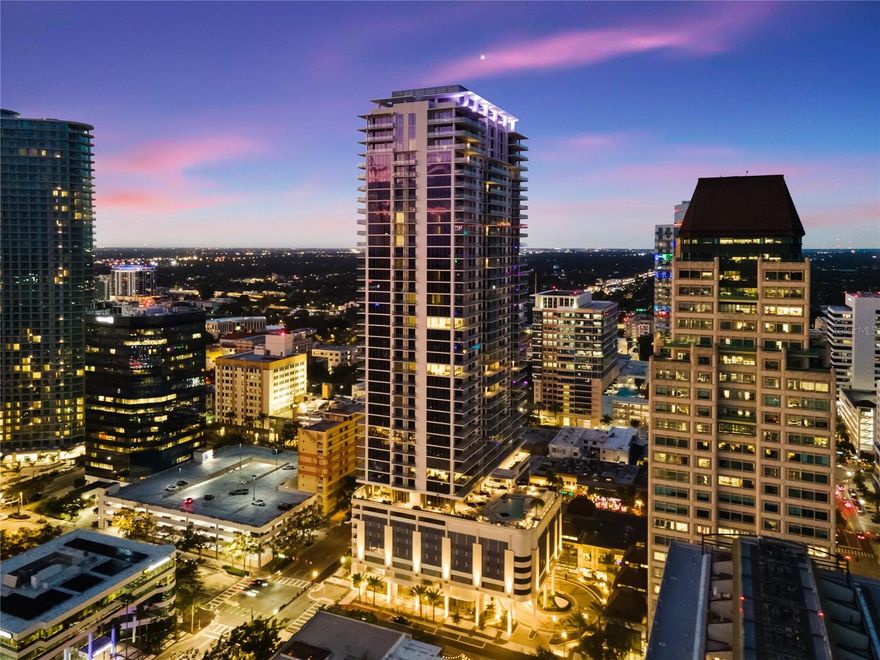 Perched high above the city, this move-in ready Grande residence at ART HOUSE, Unit 1907, offers 1,339 SF of refined living with 2 bedrooms, 2.5 baths, and a 308 SF private lanai. Designed to maximize light, views, and scale, the residence delivers a heightened sense of space and perspective rarely found in downtown St. Petersburg.

Positioned on a higher floor, Unit 1907 enjoys expansive west-facing views with sightlines to the Gulf of Mexico and glimpses of the Sunshine Skyway Bridge on clear days. By day, wide-open skies and distant water views create a sense of calm; by night, the downtown skyline and illuminated streetscapes form a dramatic urban backdrop. The spacious lanai serves as a true outdoor living space for sunsets and evening relaxation.

The kitchen is appointed with European-style cabinetry, quartz countertops, and a waterfall-edge island, complemented by a JennAir stainless-steel appliance suite including built-in refrigeration, induction cooktop, wall oven, microwave drawer, paneled dishwasher, and exterior-vented hood, along with Grohe fixtures and recessed LED lighting.

ART HOUSE offers an amenity experience unlike anything else in downtown St. Petersburg, blending wellness, design, and culture. Amenities include a golf simulator, billiards lounge, 4,200 SF fitness center with sauna and steam rooms, private studios, reservable treatment rooms, a 20-seat private theater, and a 3,000 SF covered turf dog park. Curated artwork from prominent local galleries transforms the building into a living art experience.

Ideally located just two blocks from the waterfront parks and Beach Drive, with walkable access to dining, shopping, and the arts. ART HOUSE is complete and move-in ready—secure your elevated Gulf-to-skyline view and begin living downtown today.