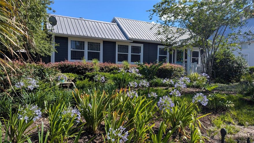 Step into a piece of Orange City history with this original 1910, dual-zoned (residential and/or commercial office) property. Beautifully updated with all of today's modern amenities without losing any of the old world charm in it's solid oak floors, chair railing, arched doorways and built-in 11' bookcase. The kitchen boasts sold wood oak cabinets with pantry (all pull-out drawers,) over and under counter lighting, quartz countertops and a beautiful built-in eating area. The bathroom has been completely remodeled while the primary bedroom has two closets including a walk-in. The large sunken third bedroom (11x18) has it's own private entrance, allowing flexibility for an office space separate from the living quarters. Energy conscious buyers will appreciate significant savings provided by the double-pane windows with wood blinds, long lasting metal roof and low average utility costs. The quiet, high and dry property has private fenced rear parking secured by an automated gate. There is a large workshop with electricity, plus private well for the sprinkler system (saving even more on utlity costs.) 

The property is just a few minutes walking distance from several municipal parks and eateries. It's also located in close proximity to 1-4, Blue Springs State Park and multiple essential city services. Universal Studios, Kennedy Space Center, Daytona Speedway and Florida's biggest attraction, Walt Disney World are all within 50 miles. 320 E Graves Ave is the perfect balance of historic character and modern convenience, so come take a peak...you will like what you see.