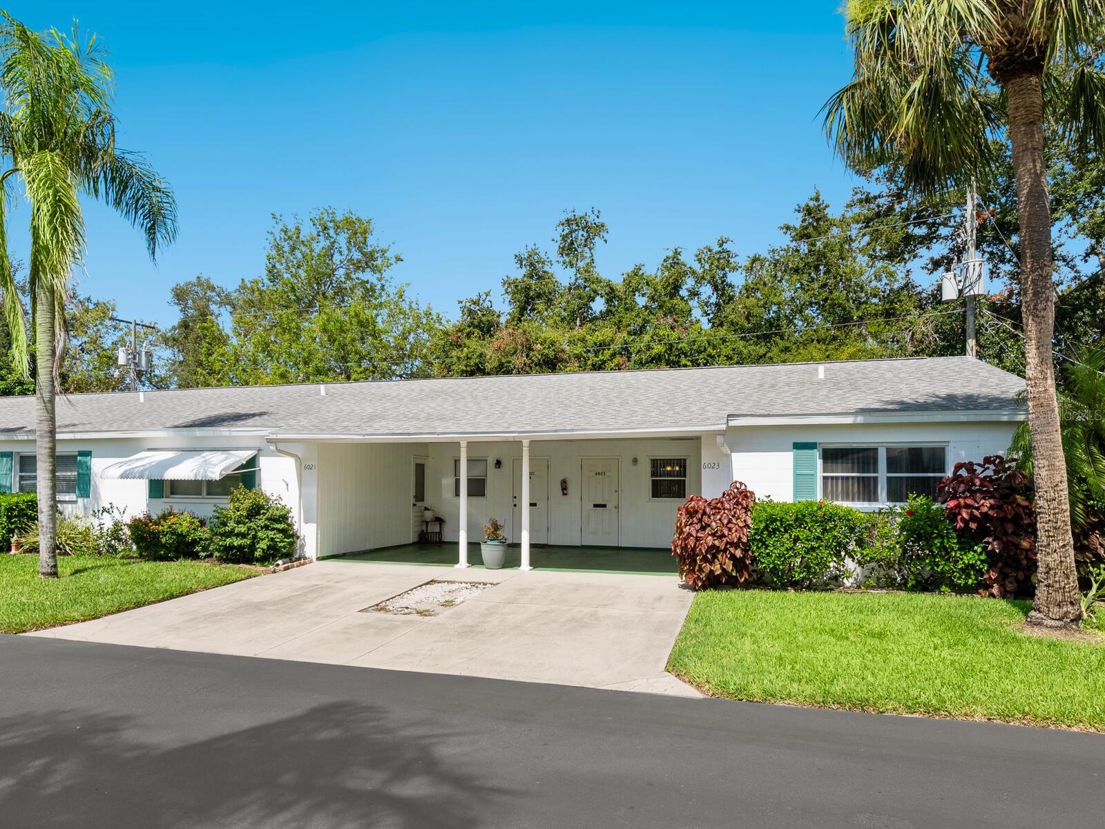 Welcome to Parkway Villas, a very well-maintained 55+ community. This charming 2 bedroom condominium features an open-concept layout combining the living and dining areas, all freshly painted with brand-new carpeting throughout. The home includes spacious walk-in closets, a newer A/C, a rear pavered patio area and an attached covered carport. Enjoy your days lounging by the solar-heated community pool, playing shuffleboard, or connecting with friendly neighbors. Parkway Villas offers a vibrant social calendar, including poker, game nights, crafts, billiards, card games, a book club, exercise classes, bingo, and bridge. The LOW monthly fee ($398) covers cable, internet, exterior building insurance, exterior painting, community pool & clubhouse, pest control, private streets, and grounds maintenance—making for a truly maintenance-free lifestyle. Please note: rentals are not permitted until after two years of ownership, and the community does not allow pets unless approved as a service animal or emotional support animal through the association. Ideally located just minutes from IMG Academy, Sarasota-Bradenton International Airport, local dining, shopping, entertainment, fishing spots, and the stunning beaches of Anna Maria Island. Schedule your private showing today and discover the lifestyle that awaits at Parkway Villas.