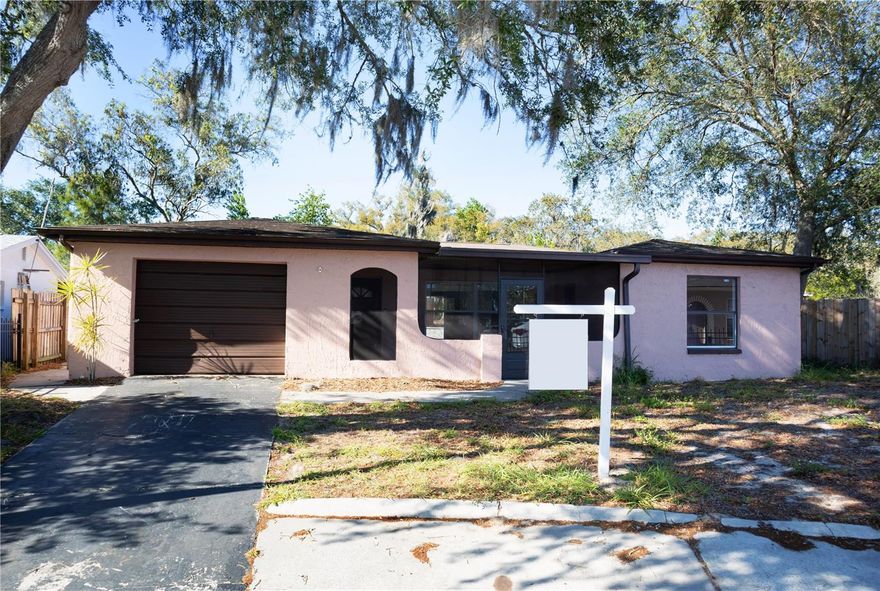 One or more photo(s) has been virtually staged. Great location for this spacious 4/5-bedroom, 2-bath pool home on a desirable corner lot! With 2,000 sq ft of living space, this home offers plenty of room to spread out and enjoy for the whole family.
The kitchen features a casual dining area and a pass-through window that opens to an oversized living and dining room combination—complete with unique flagstone flooring that adds character and charm. As you step onto the front porch, you’ll find the perfect space for your own flower or vegetable garden, or a peaceful spot to relax with Adirondack chairs.
Step outside and escape the Florida heat in your private in-ground swimming pool, ideal for relaxing or entertaining. The oversized lot offers even more to love, including a large shed/workshop/barn for your animals, swing set, and a dedicated play area—perfect for outdoor living or your furry friends. No rental restrictions, making this a great option for a primary residence or investment property.
Conveniently located near shopping, dining, and schools within a mile, this home combines space, location, and opportunity. Situated in a quiet neighborhood with great potential, it’s ready for its next owner to make it their own!