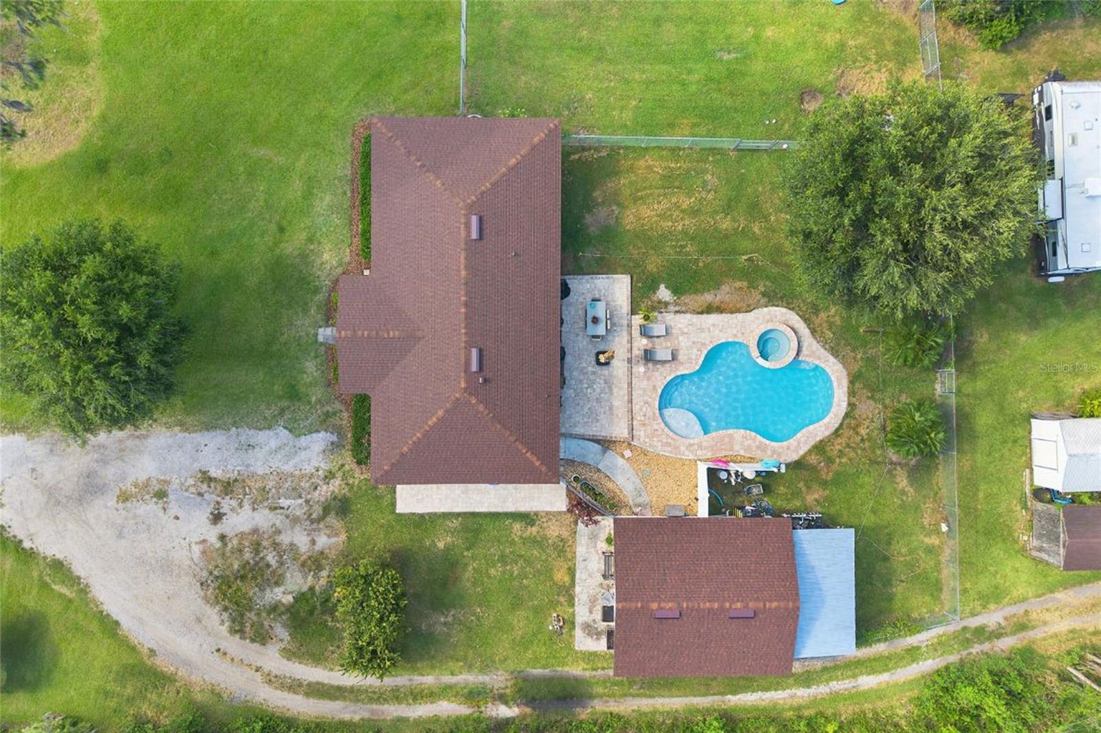 Major Price Improvement and the seller is open to contributing towards buyer's closing costs! This is your private paradise nestled on 1.59 acres of pristine land in the serene countryside! This fully updated estate has been meticulously upgraded with top-of-the-line features to provide modern luxury, comfort, and peace of mind.
Step inside main home to discover commercial-grade travertine and premium flooring throughout—durable, mold, water-resistant, and absolutely stunning. The chef’s kitchen shines with sleek stainless steel appliances, gorgeous quartz countertops, and updated cabinetry that blends style with function. Every bathroom in the home has been beautifully remodeled with high-end finishes.
No detail has been overlooked in this thoughtfully updated property. You’ll enjoy: Brand new roof (2025), A/C, and water heater; Whole-house generator for uninterrupted comfort; Saltwater pool system with a new heater and spa—perfect for relaxing or entertaining year-round; Refreshing pool fountain and a luxurious heated spa to enjoy those summer nights; Two septic tanks and two RV hookups for added functionality; Two storage sheds for all your tools, toys, or hobbies; New electrical panel (just 1 year old) with Electrical Vehicle charger.
But the true gem of this property? A detached, fully equipped mother-in-law suite just steps from the pool. Complete with its own kitchen, full bathroom, private bedroom, living room, dining area, and separate entrance—this space is ideal for guests, extended family, or even income potential.
With ample land, high-end upgrades, and incredible versatility, this turn-key estate is a rare find. Don’t miss your opportunity to own a one-of-a-kind retreat that offers unmatched space, value, privacy, value, and possibility—all in a peaceful and sought-after neighborhood.
