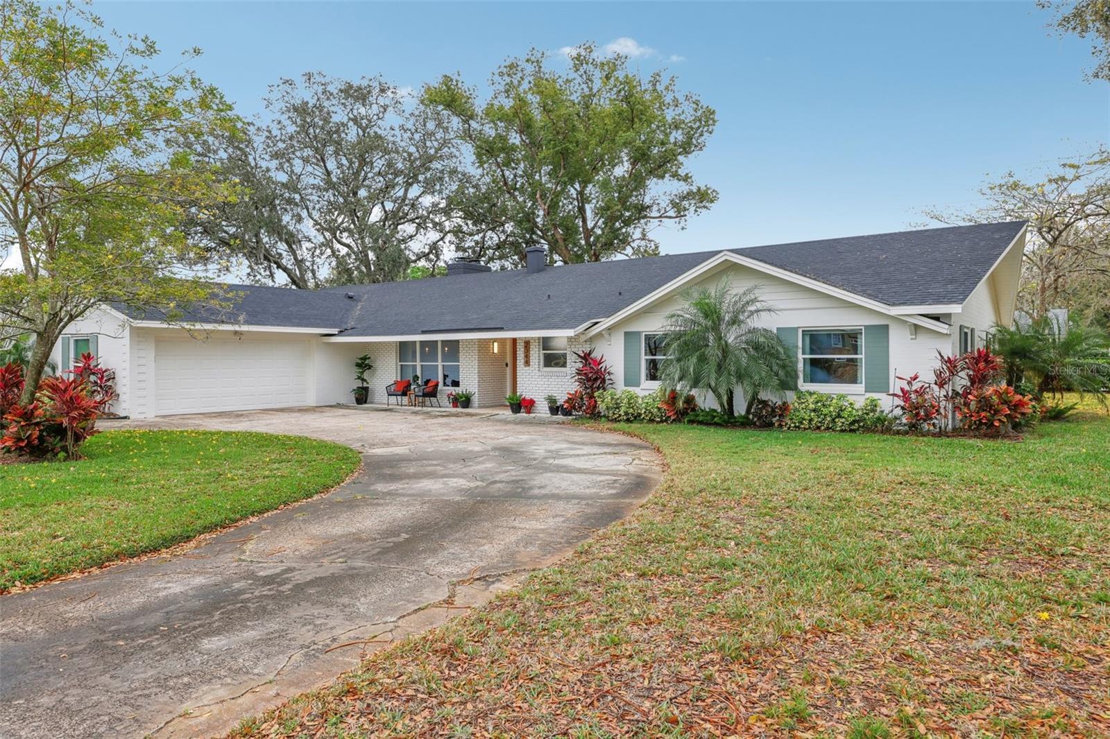 Exclusive Offer: 1% of loan amount toward closing costs or rate buy-down. Inquire today!
Welcome to this one-of-a-kind gem in the Maitland neighborhood of English Estates. Originally built in 1961 as the builder's model
home, this sprawling 2,649-square-foot ranch-style home has been tastefully and thoughtfully updated, offering a seamless blend of mid-century charm and modern convenience. Situated on a beautifully landscaped CORNER .31 ACRE LOT, this property boasts a functional CIRCULAR DRIVEWAY and 2 CAR SIDE ENTRY GARAGE. Step inside and be captivated by the natural light that pours through the abundance of windows. The large dining room at the front of the home offers views of the front yard, setting the stage for memorable gatherings. The open-concept kitchen has been updated with GRANITE countertops, MODERN cabinets, and REFINISHED TERRAZZO flooring, which flows effortlessly into the inviting family room. From here, sliding doors lead to a spacious screened patio and a FULLY ENCLOSED backyard. Walk through the family room into the living area that features a DOUBLE SIDED FIREPLACE and backyard views. The primary suite features dual closets, backyard views, and an updated en-suite bathroom with a walk-in shower. The secondary bedrooms are generously sized and share a stylish bathroom complete with a double vanity and a tub/shower combination. Additionally, the OVERSIZED INDOOR LAUNDRY ROOM, which once served as the builder's office, offers ample space and includes a convenient nearby half-bath. Significant UPDATES include modern WINDOWS, updated ELECTRICAL AND PLUMBING systems, new interior and exterior PAINT, upgraded ATTIC INSULATION, beautifully refinished terrazzo floors, well for irrigation, A/C UNIT 2019, and WATER HEATER 2017.
Enjoy the unbeatable location just minutes from downtown Winter Park, major expressways, shopping, dining, Kewannee Park, and the nearby bike trail. Don't miss your chance to experience this extraordinary home! Schedule a private tour today and see firsthand why this property truly sets the bar in English Estates.