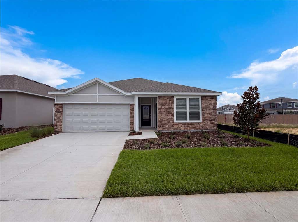 Photo of 347 Puma Loop, Groveland, FL 34736 (MLS # O6435739)