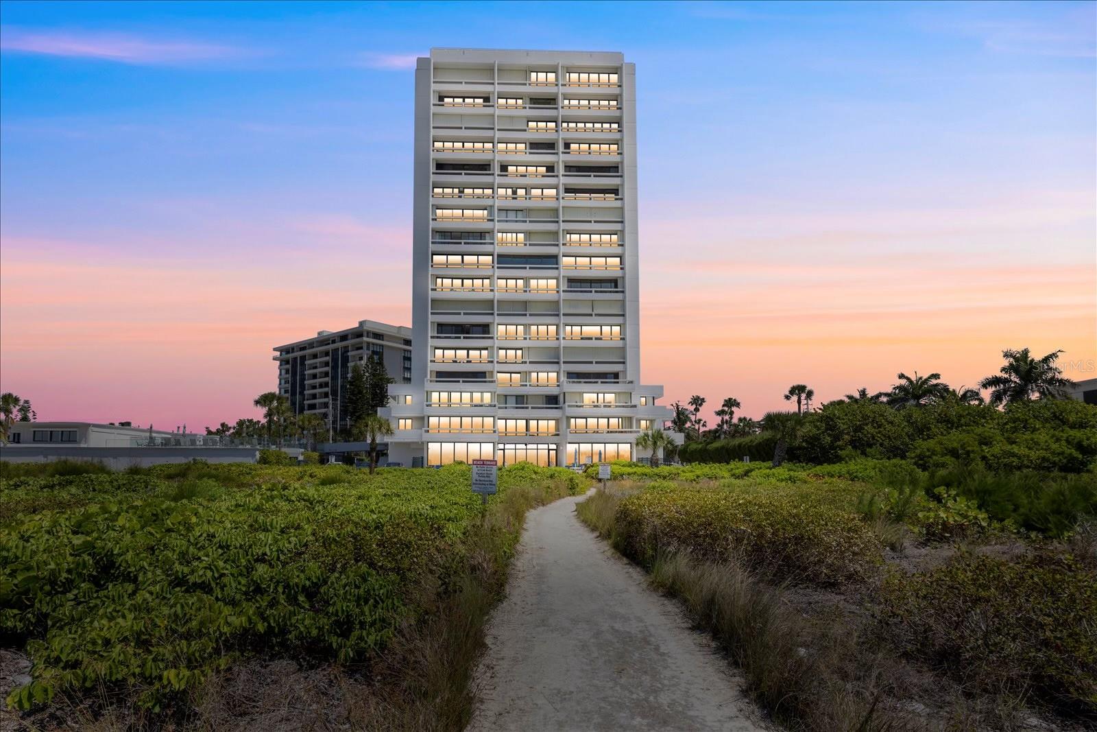 One or more photo(s) has been virtually staged. The Beach Terrace building is one of the most desirable addresses on Siesta Key with a direct Gulf of Mexico location and nestled at the end of the village. This 2 bedroom / 2 full bath corner residence offers panoramic views of the Siesta Key beach, village and aqua water of the Gulf of Mexico. The condominium offers 3 spacious balconies to enjoy morning coffee, evening sunsets and the skyline of downtown Sarasota in the distance. Enter the split floor plan residence through the entry with tiled flooring into the kitchen. The kitchen boasts updated cabinetry, appliances, lighting, granite countertops. The large living area offers dual sliders that provide expansive views throughout Siesta Key and the beach. You can enjoy just relaxing on the couch and viewing the sparkling waters of the gulf. The dining area also provides ample space for entertaining. The primary bedroom has a private balcony with views of the gulf and village. There are two full size beds and an ensuite bath and vanity area including updated tile, cabinetry and granite countertops. The second bedroom offers a full bed with an additional full sliding door for and dazzling views of the gulf. This bedroom also provides an additional bathroom with updated cabinetry, tile shower and granite. The onsite amenities include elevated heated saltwater pool, fitness center, community room all steps from private beach.