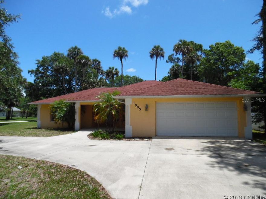 Great looking newer home with curb appeal and circular driveway, located on an oversized corner lot and on a quiet, tree lined street. Open floor plan with a modern kitchen with island and breakfast bar, tiled eat-in area and spacious pantry. Open living and dining areas with vaulted ceiling, upgraded light fixtures and fans. Private Master Suite with large closet and walk-in shower. Two additional bedrooms with one full bath in a split bedroom plan. Sunny screened lanai overlooking the partially fenced back yard. A great property at a great price! All measurements approximate. ;Water: City