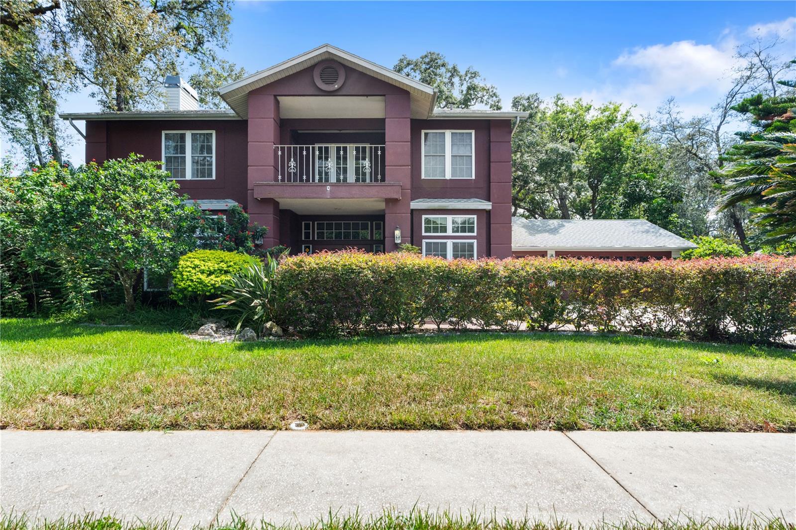Welcome to this beautifully maintained 4-bedroom, 3-bathroom pool home located in the desirable Crescent Forest community. With approximately 3,288 square feet of living space, this residence offers a spacious, open layout with high ceilings, double entry doors, and a blend of tile and carpet flooring throughout. The large living and dining areas flow into a well-equipped kitchen featuring a center island, ample cabinetry, a wine storage area, French door refrigerator, propane range, and a dedicated eat-in space—ideal for meal prep and gatherings. The kitchen opens to a screened lanai, which includes a built-in cookout area with a Fire Magic outdoor barbecue grill and a chlorine pool with a Hayward filtration system—perfect for outdoor enjoyment. A full bathroom conveniently located downstairs provides direct access from the pool area. The primary suite offers generous space with a private deck, large walk-in closet, double-sink vanity, separate shower, and garden tub. An additional room offers flexibility for use as a home office, reading room, or other personal needs. Other features include an Aspen fireplace, inside laundry room, hallway storage, and a 3-car garage. The property also includes a working irrigation system, and the landscaping features a variety of fruit-bearing trees and plants, such as guava, mango, pineapples, bananas, plantains, Hawaiian ginger, and mulberries. Recent updates include a Lennox A/C unit (2015), roof (2010), and a hybrid electric heat pump water heater (2012). This home offers a combination of comfort, space, and outdoor living in an established community. Contact your real estate professional today for a private tour. The 2 large hanging plants (Staghorn Ferns) do not convey, movers are needed to get them moved-will be done soon.