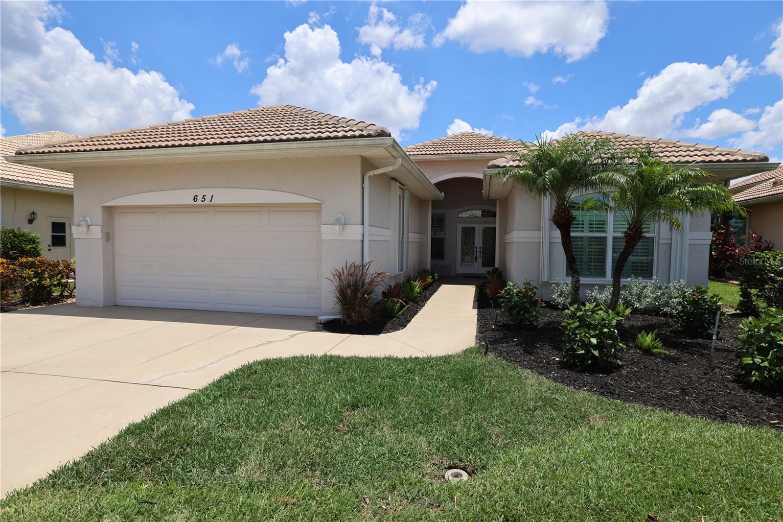 Seller will provide a one year home warranty with acceptable offer. Welcome to your dream home nestled within the picturesque Lakes of Jacaranda community in Venice, FL. This stunning residence offers breathtaking pond waterfront views and a harmonious blend of tranquility while watching wading birds from your huge screened lanai, a perfect space for relaxing or entertaining guests.
Step inside to a world of refined luxury, where real wood floors create a warm, inviting atmosphere. The open floor plan is accentuated by soaring 12-foot ceilings, intricate crown molding, plantation shutters, built-ins, adding stately charm to every room. The large kitchen is a chef’s delight, featuring pristine white cabinets that offer a fresh and modern aesthetic while providing ample storage. Accordian hurricane shutters protect all doors and windows.
Living in this deed-restricted neighborhood comes with a wealth of benefits. With low annual HOA fees of just $900 per year and no CDD fees. The community is committed to excellence, proudly installing newly paved streets for February 2025, ensuring enhanced accessibility and curb appeal.
Lakes of Jacaranda offers a vibrant lifestyle. Residents have exclusive access to a range of premium amenities, including a sparkling community pool, a welcoming clubhouse, and well-maintained tennis courts. The community features scenic walking paths meandering around serene lakes, perfect for morning jogs or leisurely evening strolls.
Embrace the opportunity to own a slice of paradise in Lakes of Jacaranda, where elegant living meets nature's beauty and community spirit thrives. This home truly encapsulates a remarkable lifestyle, combining luxury with practicality in a breathtaking setting.