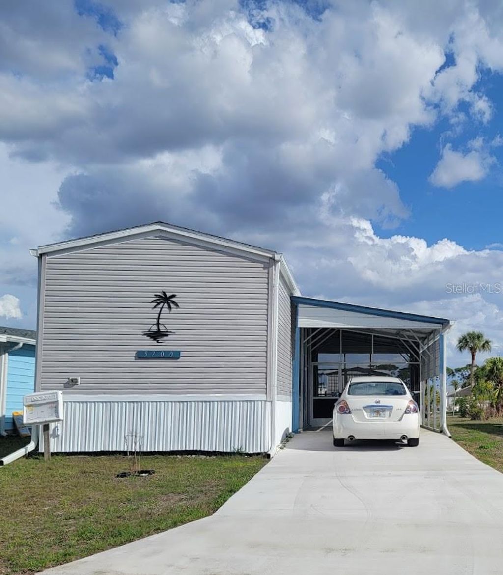 Photo of 5700 Holiday Park Boulevard, North Port, FL 34287 (MLS # A4700762)