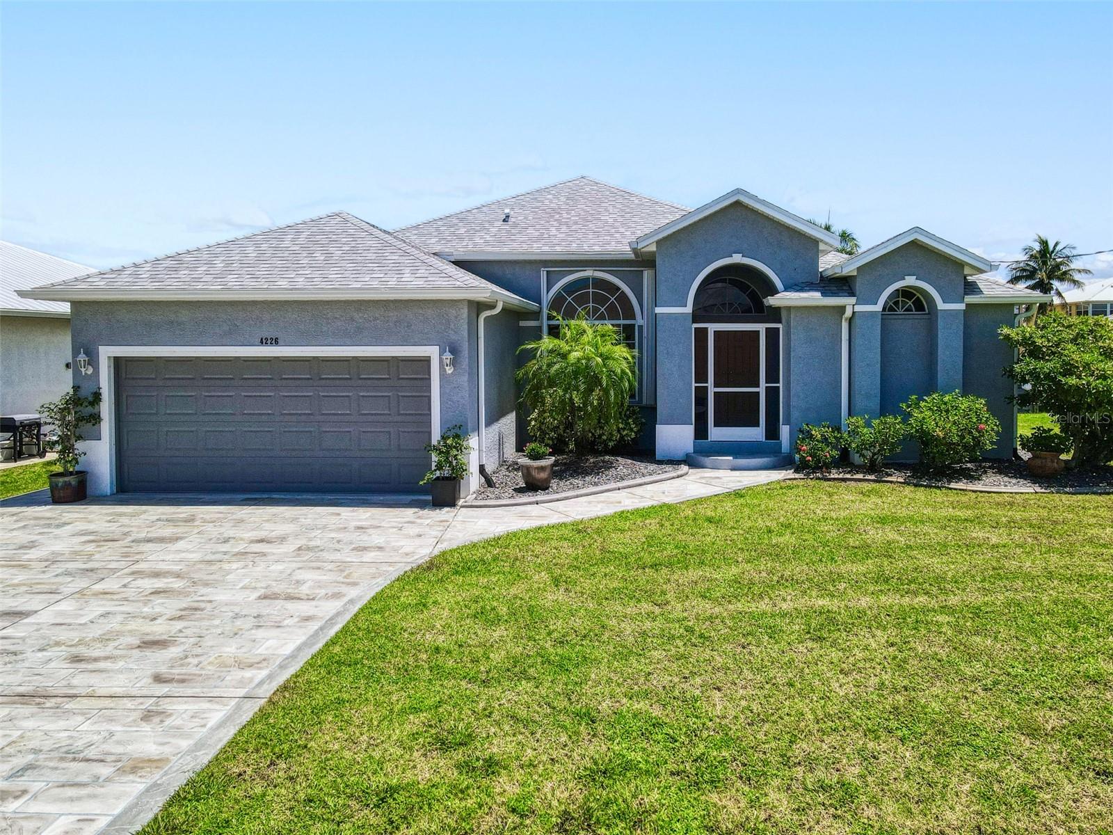 Step into effortless Florida living with this beautifully UPDATED TURNKEY CANAL-HOME, where style, comfort, and waterfront charm come together in one of Punta Gorda’s most desirable neighborhoods. Fully FURNISHED and move-in ready, this home has been thoughtfully renovated from top to bottom—ideal for full-time living, a seasonal escape, or a smart investment opportunity. Enjoy life on a SAILBOAT ACCESS canal with a private DOCK, offering direct, no-bridge access, 10 MINUTES TO THE HARBOR a dream for boating enthusiasts. This ELEVATED home features HURRICANE IMPACT WINDOWS for added peace of mind and energy efficiency, and a large screened lanai perfect for sipping your morning coffee or unwinding with friends while enjoying the coastal breeze and canal views. This 3-bedroom, 2-bath home includes a new roof, AC, and furnace, along with fresh interior and exterior paint. The kitchen and bathrooms have been remodeled, new appliances and modern light fixtures have been added, and even the front door has been replaced to enhance both security and curb appeal. The garage has been upgraded with an EPOXY FLOOR and new PRO SLAT STORAGE CABINETS, and the driveway and sidewalks have been redone for a clean, welcoming entrance. Landscaping improvements add to the home’s overall charm. The location blends convenience with the relaxed Gulf Coast lifestyle. You're just 10 minutes from I-75, offering quick access to Sarasota and Fort Myers. Englewood Beach is only 30 minutes away—perfect for weekend escapes—while the waterfront charm of downtown Punta Gorda is just 20 minutes from your door. For travelers, Punta Gorda Airport is only 15 minutes away, and Southwest Florida International Airport can be reached in about 40 minutes. You'll also find shopping, dining, medical facilities, and entertainment within a 10-minute drive. Whether you're relaxing on the lanai, heading out on the boat, or exploring all that Southwest Florida has to offer, 4226 PALM DRIVE delivers everything you need—and more. Don’t miss your chance to own this exceptional turnkey canal-front home. Schedule your private showing today!