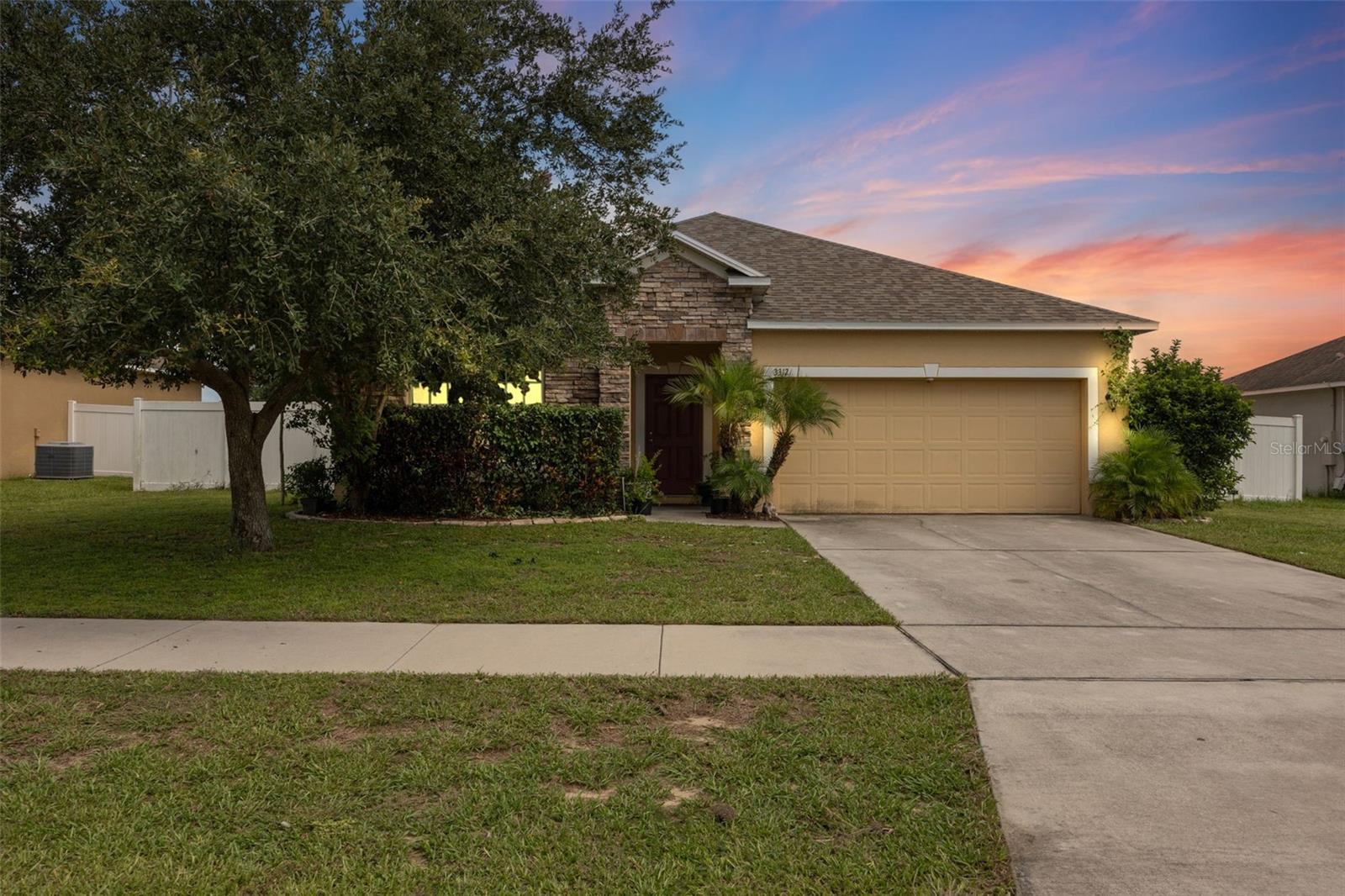 With a 1% lender credit available with preferred lender, this nearly 2,000 sq ft, 3-bedroom, 2-bath, 2-car garage home in the highly sought-after Mabel Loop Ridge subdivision was built in 2016 and features a fully paid-off solar system with a 2 year old roof! With paid off solar this will keep your electric bill to a minimum. The open floor plan offers a spacious great room with a built-in media center, a den with French doors, and a bright eat-in kitchen with 42" cabinets, solid surface countertops, upgraded appliances, and ceramic tile in all wet areas. The owner’s suite provides a peaceful retreat with a walk-in closet, dual vanities, a garden tub, and a separate shower. Enjoy the Florida lifestyle from your 10x12 covered lanai or take advantage of the oversized yard and long driveway providing ample parking. Conveniently located near US-27, I-4, Disney, Tampa, Orlando, shopping, dining, and area parks, this home combines comfort, energy efficiency, and a prime location.