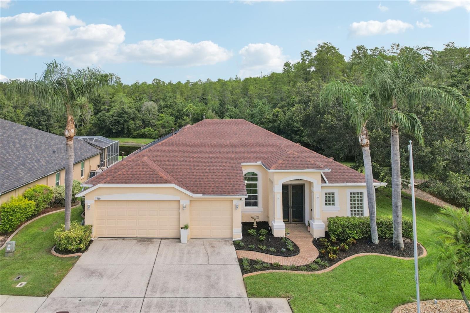 Welcome to this beautifully maintained 4-bedroom, 3-bath saltwater POOL home tucked inside the gated community of Trinity West. With peaceful conservation and water views, this home offers space, style, and thoughtful upgrades throughout. You'll love the solar-heated saltwater pool, 3-car garage with reinforced doors complete with a mini-split A/C. Step into a bright, open interior layout featuring tile and laminate floors, crown molding, and a spacious kitchen with a breakfast bar and plenty of cabinet space.
Enjoy outdoor living in the private backyard oasis—perfect for your morning coffee or a relaxing and refreshing swim in your private solar-heated pool. Watch deer, otters, and wild turkeys right from your patio—true Florida charm at its finest! Other highlights include SunScreen window treatments, hurricane shutters, and a natural gas hookup for your grill. With a low HOA, top-rated schools nearby, and easy access to shopping, dining, and medical care, this home checks all the boxes. This is Florida living at its finest!