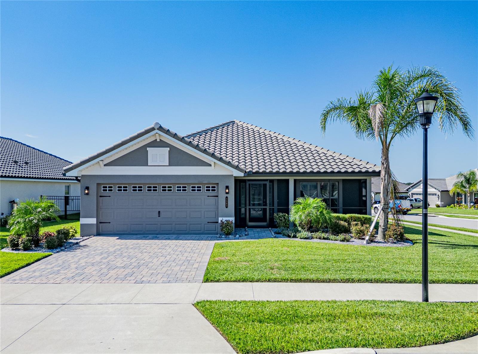 Welcome to 4903 Vue Delac Pass—a beautifully upgraded 4-bedroom, 3-bathroom home in the highly sought-after Lake Juliana Estates. Built by Adams Homes, this 2,200 sq ft property includes a private in-law suite with its own full bath, perfect for extended family or guests.
Inside, you’ll find wood-look porcelain tile throughout the main living areas, with plush carpet in all bedrooms. The kitchen features granite countertops, reverse osmosis drinking water, and a whole-house water filtration and softening system. Enjoy energy-efficient comfort and style with plantation shutters on every window and a custom glass front door that welcomes you in.
Step outside to a screened-in front porch and screened back patio—both upgraded with pet-safe screens—and a fully fenced yard with privacy hedges. Additional exterior features include rain gutters, a tile roof, and a brick paver driveway leading to the spacious 2-car garage.
Located in the gated community of Lake Juliana Estates, residents enjoy resort-style amenities including a community pool, clubhouse, fitness center, tennis and pickleball courts, basketball court, playground, and private boat ramp access to Lake Juliana.
Conveniently situated just minutes from I-4, this home is centrally located between Orlando and Tampa, with easy access to both North and South Lakeland in 15–20 minutes. A brand new Publix, shopping, and restaurants are located just outside the community entrance—everything you need is close to home.
This home checks every box—space, style, upgrades, and location. Come see it before it’s gone!