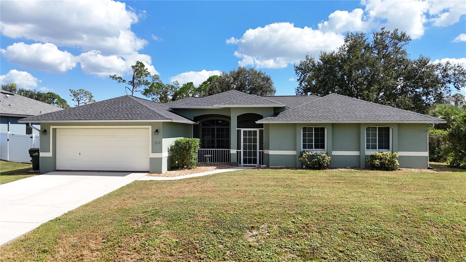 **TAKE A STROLL THROUGH YOUR NEW HOME WITH THE 3D INTERACTIVE VIRTUAL TOUR** Welcome to your dream POOL HOME — a beautifully maintained 3-bedroom + DEN, 2-bath, 2-car garage retreat with a 2023 ROOF and a brand-new 2025 water system, perfectly blending comfort, style, and functionality. If privacy tops your list, this home delivers! Nestled on a peaceful greenbelt, you’ll love that your neighbors aren’t right on top of you. Pull up to lush, manicured landscaping with vibrant greenery, pebble rock accents, and blooming plants leading you to the charming screened front porch — an ideal spot to sip coffee and soak in the Florida sunshine. Step inside and be welcomed by soaring vaulted ceilings, NEW 2025 Luxury Vinyl Plank flooring, and an open, split-bedroom floorplan designed for both entertaining and everyday comfort. The formal dining room offers a versatile space that could easily double as a home office, playroom, or game room — the options are endless! The living room features stylish wainscoting, a chair rail accent wall, and sliding glass doors that open to your lanai with serene backyard views — perfect for hosting family and friends. Beyond the French doors, a den provides the flexibility for a 4th bedroom or office. At the heart of the home, the FULLY REMODELED GOURMET KITCHEN is a showstopper — complete with QUARTZ countertops & backsplash, soft-close cabinetry, under-cabinet lighting, farmhouse sink, pantry, and abundant workspace. You’ll love the spacious breakfast bar, newer stainless-steel appliances, and a CUSTOM COFFEE/WINE BAR featuring a butcher-block counter, decorative backsplash, and built-in wine cooler. Enjoy your morning coffee from the cozy breakfast nook, framed by aquarium windows overlooking your 24' x 12' private pool and backyard oasis. The family room ties it all together with a stylish wallpaper accent that complements the navy-blue kitchen — creating a warm, cohesive flow that’s perfect for movie nights or relaxing evenings in. The owner’s suite is a true retreat with dual walk-in closets and a luxurious en-suite REMODELED BATH showcasing double vanities with quartz countertops, a private water closet, walk-in rain shower, and a soaking tub under a picturesque window — the perfect place to unwind after a long day. Two additional bedrooms and a beautifully updated guest bath sit on the opposite side of the home for ideal privacy. Step outside to your backyard paradise! The FENCED yard is perfect for kids and pets, while the sparkling pool invites you to take a dip or lounge in the sun. Enjoy your mornings with coffee, your afternoons grilling, and your evenings dining al fresco — this is the Florida lifestyle you’ve been dreaming of! Located just minutes from Coco Plum Shopping Center, top-rated schools, golf courses, and dining. A short drive brings you to the Gulf Beaches, Charlotte Harbor, Boca Grande, and Englewood — perfect for boaters and beach lovers alike! Sports fans will love being near Charlotte Sports Park (Spring Training home of the Tampa Bay Rays) and the vibrant Wellen Park, where you can catch an Atlanta Braves game, shop, dine, or stroll through the Sunday Farmers Market. With easy access to US-41 and I-75, you can travel north or south with ease. This home has it all — modern upgrades, privacy, and that Florida flair! Add it to your must-see list and start packing today!