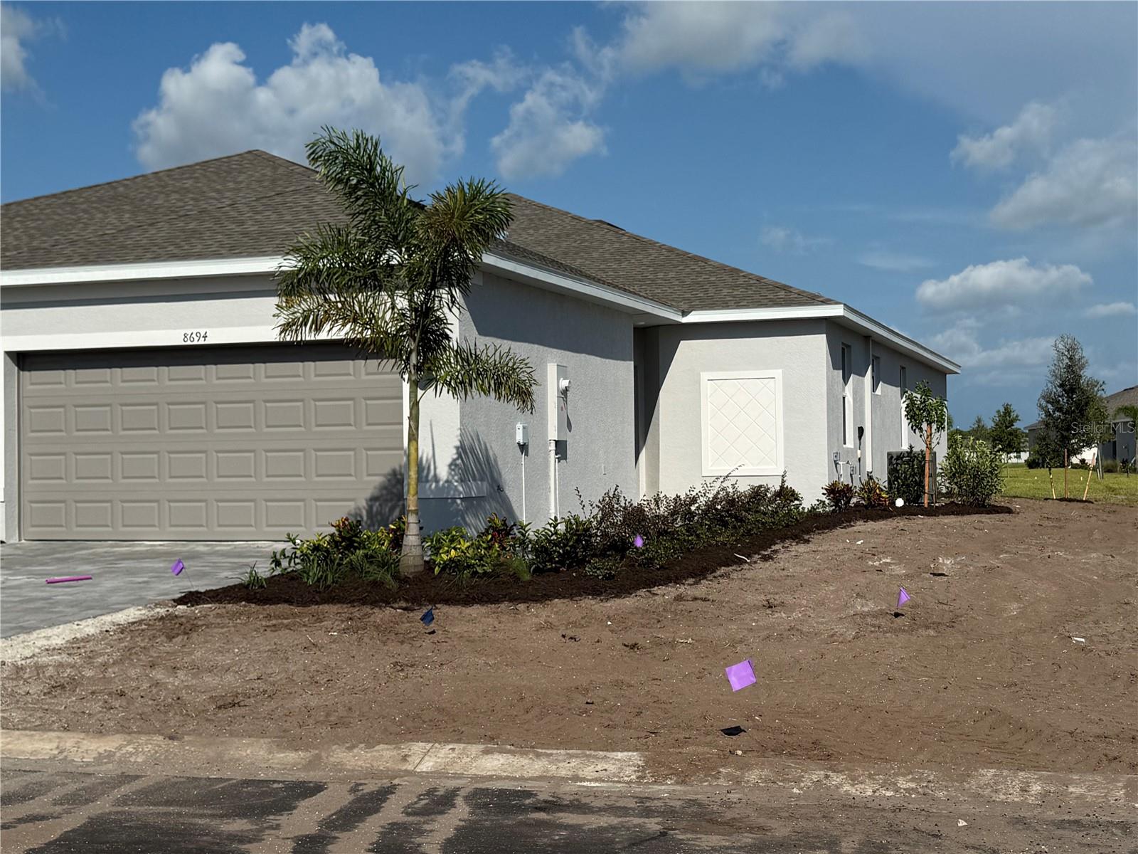 One or more photo(s) has been virtually staged. Discover coastal living in Island Lakes at Coco Bay with this well-designed 3-bedroom, 2-bath villa in Englewood. The single-level floor plan features a spacious kitchen with stainless steel appliances, quartz countertops, and plenty of cabinet space, opening to the combined living and dining areas. The private owner’s suite includes an en-suite bathroom, while two additional bedrooms and a full bath are located at the front of the home. Enjoy the outdoors on the covered lanai. Ceramic tile flooring runs throughout the home, and a washer, dryer, and two-car garage add convenience. HOA includes lawn maintenance, cable, and internet. Community amenities include a clubhouse, resort-style pool, and sports courts. Located just minutes from Englewood Beach, shopping, dining, and golf. Ideal for year-round living, a vacation home, or investment. Schedule your showing today.
