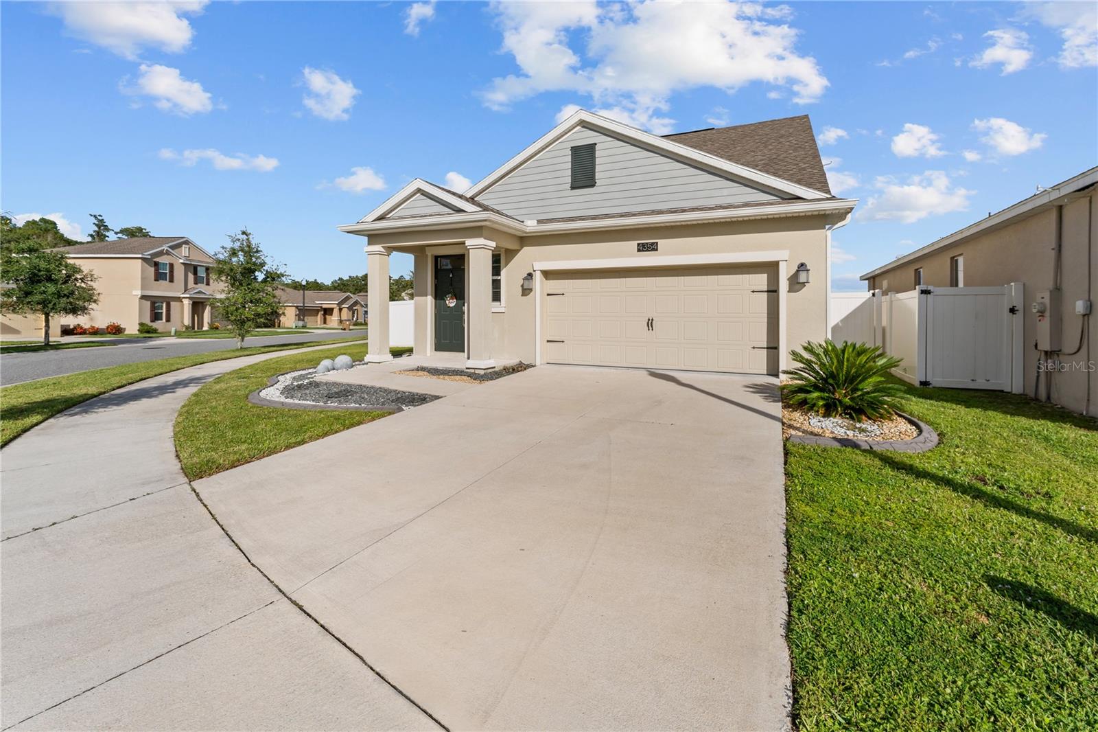 SPECTACULAR 2021-BUILT TWO-STORY HOME WITH WATER VIEW! This beautiful modern home offers the perfect blend of contemporary design and serene lakefront living in a desirable Kissimmee community. This well-designed home features an open-concept floor plan that maximizes both space and the breathtaking water views. The heart of the home showcases a gourmet kitchen with elegant quartz countertops, rich dark wood cabinetry, and modern stainless steel appliances including a convenient breakfast bar perfect for casual dining and entertaining. The first floor boasts beautiful ceramic tile flooring throughout, creating a seamless flow from the spacious living areas to the dining space. Large windows and sliding glass doors flood the interior with natural light while framing the spectacular lake views that can be enjoyed from the owners suite in the first floor. The screened-in lanai is a true highlight, offering the perfect outdoor living space to relax and entertain while taking in the panoramic water views. String lights create a magical ambiance for evening gatherings, while the screened enclosure provides year-round comfort from Florida's elements. The two-story layout provides excellent separation of living spaces offering 2 Bedrooms and a loft in the second floor. The home's modern design includes contemporary light fixtures, ceiling fans, and an efficient open floor plan that's perfect for today's lifestyle. Located in a vibrant community that offers resort-style amenities including a clubhouse, sparkling community pool, and playground - perfect for families or those who enjoy an active lifestyle. The prime lakefront location provides tranquil water views and a sense of peaceful retreat while remaining conveniently located in Kissimmee. This nearly-new home combines modern luxury with stunning natural beauty, offering move-in ready comfort in one of the area's most sought-after locations!