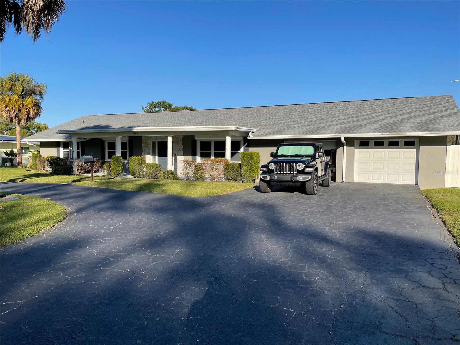 Comfortable pool home on a large 1/2 acre fenced lot. Professionally Renovated in 2020 with custom kitchen, new flooring throughout, both bathrooms fully renovated with new plumbing, new pool & enclosure, and paver deck. Roof replaced in 2022. Owned water softener system, R/O filter to Fridge, serviced.
Large laundry room with laundry tub and Electrolux washer & dryer.
The kitchen features custom Kraftmaid cabinetry with plenty of pull-out shelving and storage features, Kitchenaid Appliances, vented steel range hood, convection wall oven with built-in microwave. Clean and pristine with quartz countertops with a glass tile backsplash. The kitchen adjoins both the formal dining and dinette areas- smart lighting switches in main living areas. Durable glued-down engineered hardwood flooring in main living areas, tile in bathrooms, water-resistant vinyl plank in the Laundry.
Roomy extra-wide garage with dual opening garage doors and additional utility space, side door access to yard- attic storage above the garage, with blown-in insulation above garage space. Garage has wifi enabled min-split for dehumidification or necessary climate control.
Covered area for dining and lounging on the paver pool deck near the heated pool- an efficient spa-pool combination in one, with a spacious screen enclosure for sun seekers. Remote for Pool system. Like a big yard? Big lot has room for play plus RV parking in the side yard, 6 ft privacy fence with large gated entrance.
Location is ideal- 13 minutes to Bradenton beach, half that for dining and shopping. NOT in a flood zone or evacuation zone could mean lower home insurance expenses. Can be sold furnished with exclusions. Not in a special hazard flood zone. Roll-down storm shutters for all large windows, metal shutters for most others.
Sellers are licensed FL real estate agents.