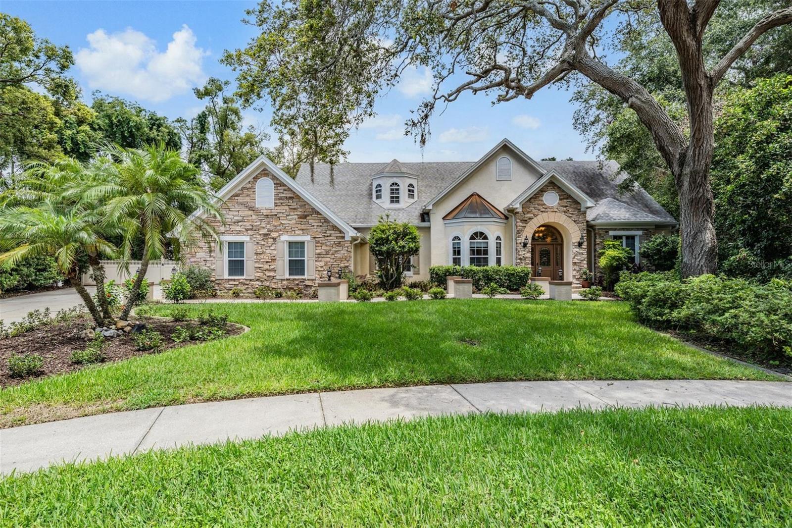 PRICE REDUCED - VIDEO walkthrough - click the link - Welcome to beautiful Chelsea Woods neighborhood - quiet, non-evacuation zone, cul-de-sac neighborhood, conveniently located close to airports, shopping and parks built in 1996. Dual master suites, one upstairs and one down allows for multi-generational living.
Some notable features of this custom home include –
* New kitchen (2019) natural gas cooktop/double ovens
* New roof (2019)
* Gas fireplace Â
* 2-zone HVAc w/HALO LED purification
* Bluetooth audio system throughout the home
* Central vacuum system
* Natural gas grilling area adjacent to heated pool/hot tub
* Ample entertaining pool side
* Hobby room on 2nd floor
* 3 car/side entry garage with pull down attic access
* Secluded oversized lot at the end of cul-de-sac
* Discrete pet door to the lanai.
Come enjoy a stroll through this lovely home and envision how your family would live, love, and entertain in this ample space.