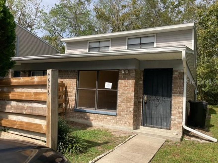 If the location of Haystacks is the convenience you are seeking, look no farther.  Just 1.3 miles from Celebration Pointe and the convenience of the bus line to UF campus nearby, this gorgeous townhouse offers it all.  This cozy 2 Bd/2BA brick townhouse features a large living area with pass through and entrance to the kitchen.  You can prepare a meal in the kitchen and always be a part of the action of a UF game in the living room.  This spacious kitchen features granite countertops, refrigerator, dishwasher, stove and range hood.  It offers beautiful kitchen cabinetry and updated baths.  The amenities include wood laminate flooring throughout and tile in baths. With a separate bedroom and bath upstairs and a bedroom and bath downstairs, it is ideal for couples wishing their own space. Nice sized back yard to hang out and grill and a wooded area in the back to provide privacy.  Run, don't walk!  This one will go fast.