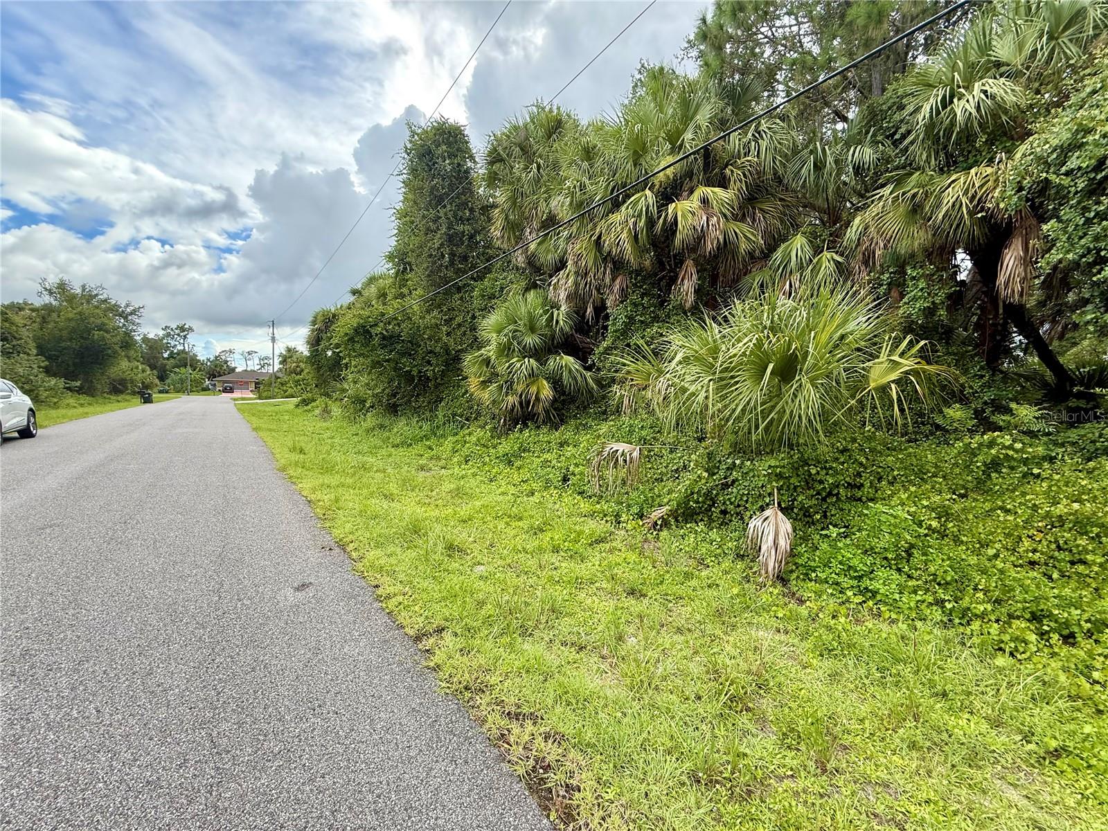 Looking for that perfect piece of land to build your slice of paradise on? Here's a great lot in this fabulous area of North Port! NO flood insurance required, save money and build with confidence!!! Electric at site, and no need to worry about mitigating Scrub Jays as property is NOT located in a habitat. Bring all your toys...store your RV, boat, kayaks, put up a detached garage, shed for an art studio, trampoline, or treehouse, doesn't matter as this is a non-deed restricted area of Sarasota County! And of course, what could be more Florida than having your own pool which the property has plenty of room for! Property is close to all amenities including sandy beaches & crystal waters of Venice, Englewood & Boca Grande Beaches, Golf Courses, boat launches, minutes from TWO Spring training Stadiums, the Rays & the Braves who hosts games against the Yankees, Red Sox, Mets & more. Have local builder with floorplans of 3 bedroom 2 bathroom homes with 10’ ceilings, 8’ doors porcelain plank flooring throughout, Quartz/Granite, lighting & fans, appliances, Impact windows…all-inclusive pricing starting at $320,000.