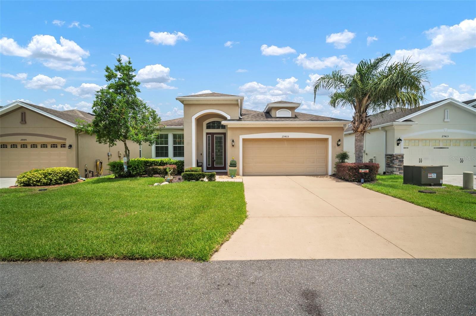 Welcome to 29405 Cochiti Lake Drive, located in the gated 55+ community of Tampa Bay Golf & Country Club! This beautifully maintained 3-bedroom, 2-bathroom Pembroke model offers 1,731 square feet of living space and is ideally situated across from open green space with no front-facing neighbors — providing added privacy and a peaceful view.
Inside, you’ll find a bright and open split-bedroom layout featuring a spacious great room, formal dining area, and an eat-in kitchen. The primary suite includes a walk-in closet and en-suite bath, while two additional bedrooms provide flexibility for guests or a home office. At the back, a covered and screened lanai overlooks a private backyard, perfect for outdoor relaxation.
Additional features include a screened-in 2-car garage, ideal for enjoying fresh air while keeping bugs out, and added curb appeal.
Enjoy resort-style living in this premier 55+ community, which offers two golf courses, two swimming pools, tennis and pickleball courts, fitness center, clubhouse, on-site dining, and a wide array of social activities and events.
Conveniently located near I-75 with easy access to shopping, dining, medical facilities, and everything the Tampa Bay area has to offer.
Don’t miss this opportunity to live the Florida lifestyle — schedule your private tour today!