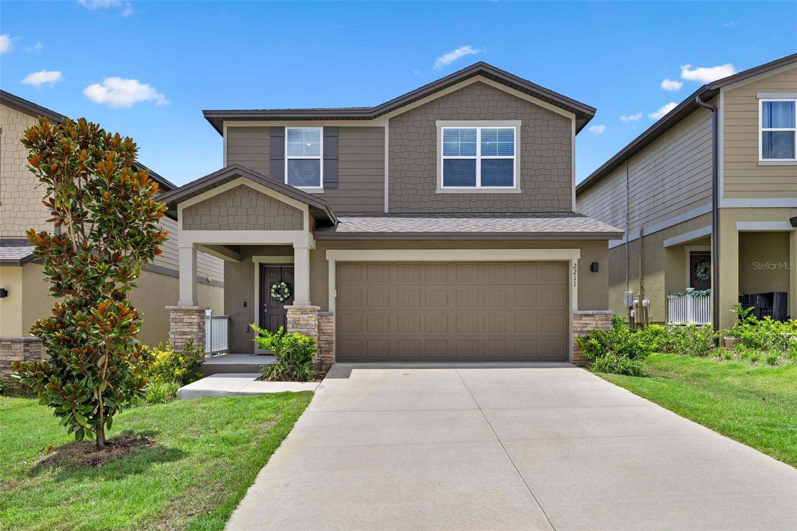 Welcome home to this practically new, stunning 3-bedroom, 2.5-bath Endeavor model home by Starlight. Offering 1,676 sq. ft. of modern living space and a 2-car garage in the highly desirable Hills of Minneola community. Step inside to discover a bright, open-concept layout where the spacious family room flows seamlessly into a stylish kitchen and dining area, perfect for entertaining or relaxing at home. The kitchen features granite countertops, stainless steel appliances, a pantry, and generous storage space. Upstairs, the inviting primary suite includes a large bedroom, private en suite bath, and walk-in closet. Two additional bedrooms and a full bath provide ample space for family, guests, or a home office. Luxury vinyl flooring extends throughout the entire home while an upstairs laundry room and a convenient half bath downstairs add to the home's functionality. The Hills of Minneola offers community amenities including a playground and dog park, with a resort-style pool and expansive clubhouse currently under construction. Located just minutes from the Turnpike, shopping, dining, and exciting new additions such as the brand-new K-8 Minneola Horizon Academy opening next month, hospital, Crooked Can Brewery opening next summer, and so much more. This home puts you at the center of one of Central Florida’s fastest-growing areas. Don’t wait for new construction when you can move right in. Schedule your private showing today!