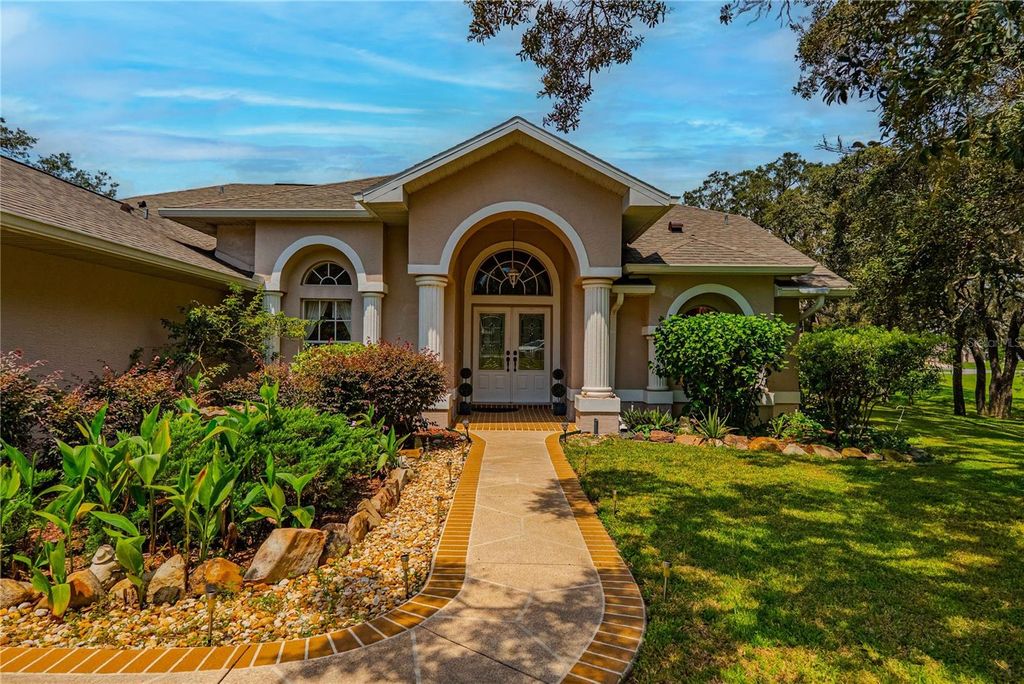 Photo of 63 Forest Wood Court, Spring Hill, FL 34609 (MLS # TB8439244)