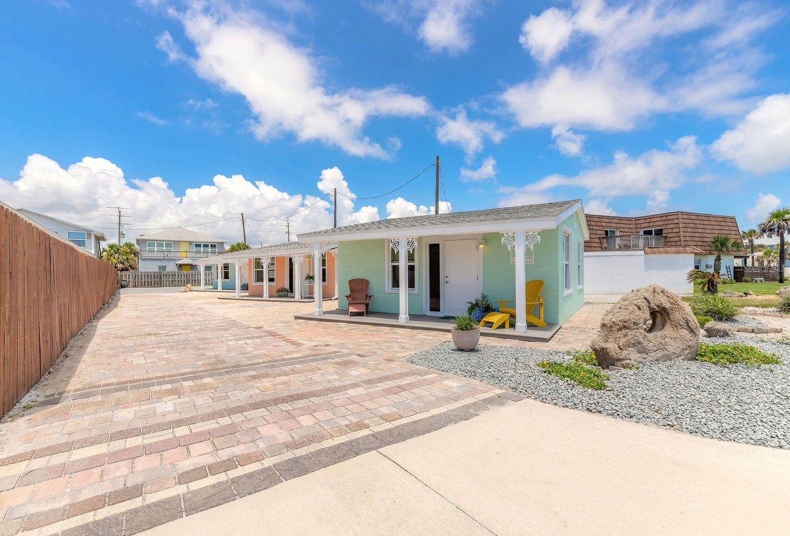Hot Off the Press! Three Beautiful Renovated Flagler Beach Cottages. Zoned Hotel District. Airbnb Allowed. Walk to the Beach! All Cottages have an Ocean View! Located Near Shops and Restaurant's. Swim at the Beach then Relax on the Front Porch. Cottage One is a Two Bed One Bath and Sleeps 4. Cottage Two is a Two Bed One Bath and Sleeps 4. Cottage Three is a One Bed One Bath Plus a Sleeper Sofa and Sleeps 4. Separate Renovated Laundry Room with Storage. Really Cool Surfboard Outside Shower! Brand New Roof! Furniture Included!