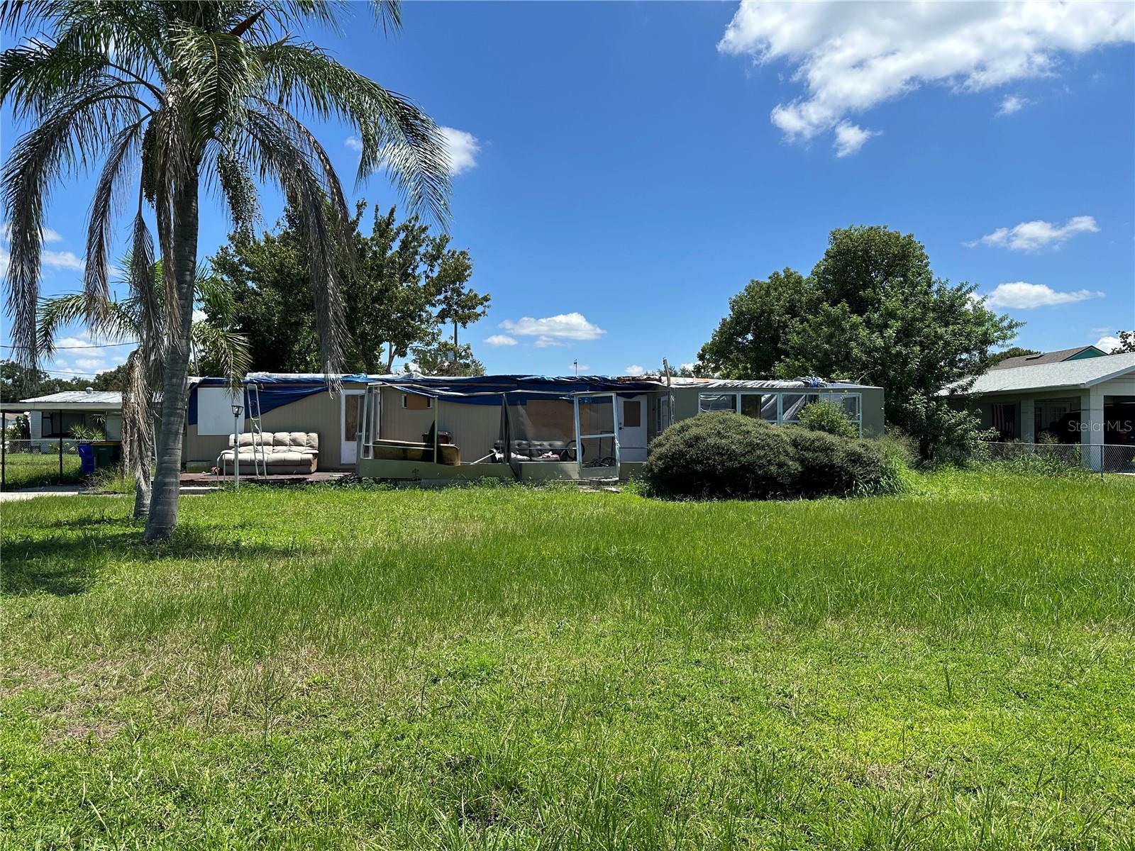 Mobile Home is Uninhabitable. Mobile home will be taken off lot soon. Selling as vacant land. Zoned MH-A ready for a new mobile home. Lot is .231 acres with septic tank, city water, and electricity. Please DO NOT enter property.