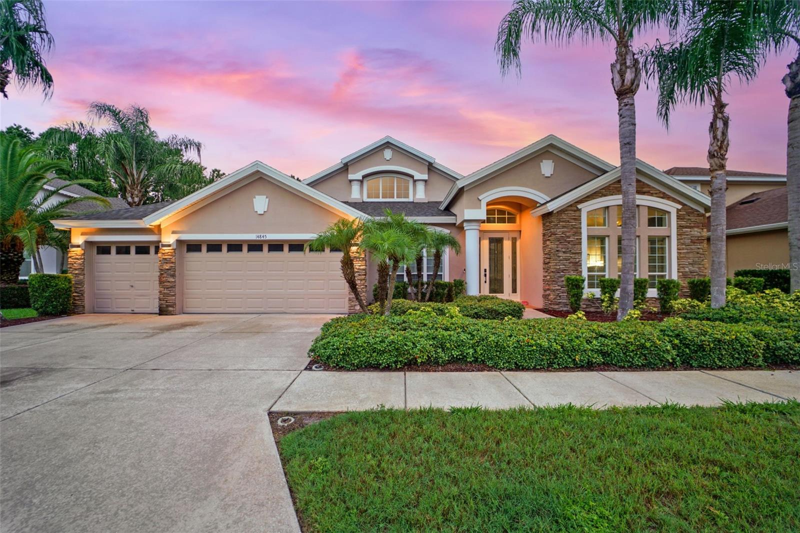 Your Home Search Ends Here!
Welcome To This Stunning 5-Bedroom, 3-Bathroom, 3-Car Garage Home Offering 3,612 Sq Ft Of Thoughtfully Designed Living Space In The Highly Sought-After Community Of Grey Hawk. This Cul-de-sac Home is Move-In Ready And Packed With Luxury Upgrades, This Home Has It All!
Step Inside To Find Soaring Cathedral Ceilings, Elegant Archways, Niches, Tray Ceilings, And An Abundance of Windows, Creating Architectural Interest Throughout. A Timeless 18-Ft Custom Feature Wall Anchors The Great Room With Oversized Marble-Inspired Ceramic Tile, A Color-Changing Electric Fireplace, And Built-In Space For A 90” TV And Sound Bar.
The Heart Of The Home Is The Gourmet Kitchen Featuring A Wine/Coffee Bar, Beverage Refrigerator, Newer Double Ovens, Large Center Island With Storage And Outlets, Walk-In Pantry, And 42” Maple Cabinetry. Real Hardwood Floors Span The Entire Home With Ceramic Tile In Wet Areas, Complemented By Designer Light Fixtures And New Interior Paint.
Retreat To The Expansive Primary Suite With Sitting Area, And Spa-Like Bath Including Dual Vanities, Step in Shower, Garden Tub, And Luxurious Walk-In Closet with Custom Closet System.
Additional Highlights Include A Separate Office / Flex Space, Elegantly Appointed Dining Room, Upstairs Bonus Room / Theater With Custom Storage Wall, Large Laundry Room, Triple Split Floor Plan Features All Bedrooms Located on the First Floor, and Two Additional Full Bathrooms, One of Which Is Accessible From The Pool Deck.
Entertain At Home In Your Heated Saltwater Pool Featuring A Sun Shelf, Spillover, And Fountain Powered By An Aqua-Cal Heat Pump (Warranty Through 2028). Enjoy The Screened Lanai With Travertine Pavers, Custom Trim Lighting, Rain or Shine Retreat To Your Covered Back Patio, Overlooking the Stunning Outdoor Oasis.
Peace Of Mind Comes With A 2025 NEW ROOF (Transferable Warranty), WHOLE-HOME Generac Generator (500-Gallon Propane Tank, Serviced June 2025), Continuous Termite And Pest Protection, Fully Fenced Yard, And A Vivint Monitored Security System With Cameras And Smart Garage Access.
Additional Features, Stone Accents on Front Elevation For Year-Round Curb Appeal, Smart Thermostats, Two Air Conditioning Units, Water Softener, Ceiling Fans Throughout, Prewired for Sound System in the Great Room and Upstairs Bonus Room, And An Epoxy-Coated Garage Floor.
Located In A Pedestrian-Friendly Community With Lake Access via Shared Community Dock, A Manned Guard Gate, And A Park Offering Tennis, Volleyball, Basketball, Playground, And Dog Park. Plus Fun-Filled Holiday Celebrations All Year Long!
This Home Combines Style, Function, And Total Peace Of Mind. Schedule Your Private Tour Today!