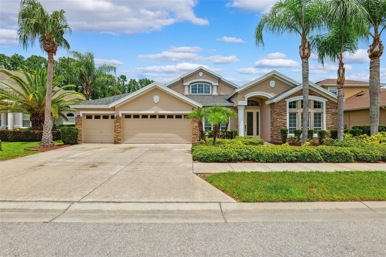 Your Home Search Ends Here!
Welcome To This Stunning 5-Bedroom, 3-Bathroom, 3-Car Garage Home Offering 3,612 Sq Ft Of Thoughtfully Designed Living Space In The Highly Sought-After Community Of Grey Hawk. This Cul-de-sac Home is Move-In Ready And Packed With Luxury Upgrades, This Home Has It All!
Step Inside To Find Soaring Cathedral Ceilings, Elegant Archways, Niches, Tray Ceilings, And An Abundance of Windows, Creating Architectural Interest Throughout. A Timeless 18-Ft Custom Feature Wall Anchors The Great Room With Oversized Marble-Inspired Ceramic Tile, A Color-Changing Electric Fireplace, And Built-In Space For A 90” TV And Sound Bar.
The Heart Of The Home Is The Gourmet Kitchen Featuring A Wine/Coffee Bar, Beverage Refrigerator, Newer Double Ovens, Large Center Island With Storage And Outlets, Walk-In Pantry, And 42” Maple Cabinetry. Real Hardwood Floors Span The Entire Home With Ceramic Tile In Wet Areas, Complemented By Designer Light Fixtures And New Interior Paint.
Retreat To The Expansive Primary Suite With Sitting Area, And Spa-Like Bath Including Dual Vanities, Step in Shower, Garden Tub, And Luxurious Walk-In Closet with Custom Closet System.
Additional Highlights Include A Separate Office / Flex Space, Elegantly Appointed Dining Room, Upstairs Bonus Room / Theater With Custom Storage Wall, Large Laundry Room, Triple Split Floor Plan Features All Bedrooms Located on the First Floor, and Two Additional Full Bathrooms, One of Which Is Accessible From The Pool Deck.
Entertain At Home In Your Heated Saltwater Pool Featuring A Sun Shelf, Spillover, And Fountain Powered By An Aqua-Cal Heat Pump (Warranty Through 2028). Enjoy The Screened Lanai With Travertine Pavers, Custom Trim Lighting, Rain or Shine Retreat To Your Covered Back Patio, Overlooking the Stunning Outdoor Oasis.
Peace Of Mind Comes With A 2025 NEW ROOF (Transferable Warranty), WHOLE-HOME Generac Generator (500-Gallon Propane Tank, Serviced June 2025), Continuous Termite And Pest Protection, Fully Fenced Yard, And A Vivint Monitored Security System With Cameras And Smart Garage Access.
Additional Features, Stone Accents on Front Elevation For Year-Round Curb Appeal, Smart Thermostats, Two Air Conditioning Units, Water Softener, Ceiling Fans Throughout, Prewired for Sound System in the Great Room and Upstairs Bonus Room, And An Epoxy-Coated Garage Floor.
Located In A Pedestrian-Friendly Community With Lake Access via Shared Community Dock, A Manned Guard Gate, And A Park Offering Tennis, Volleyball, Basketball, Playground, And Dog Park. Plus Fun-Filled Holiday Celebrations All Year Long!
This Home Combines Style, Function, And Total Peace Of Mind. Schedule Your Private Tour Today!
