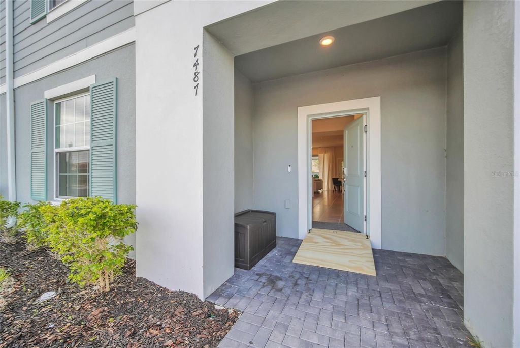 Photo of 7487 Oakmoss Loop, Davenport, FL 33837 (MLS # O6385813)