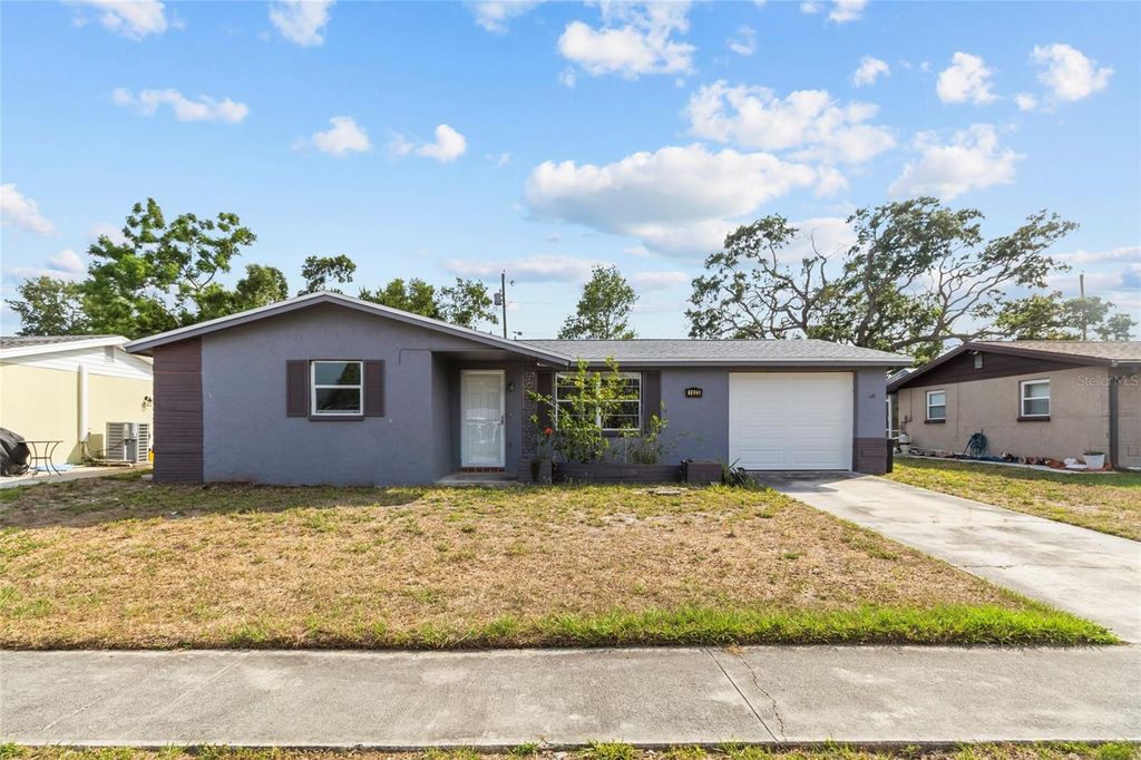 Photo of 1623 Plum Tree Road, Holiday, FL 34690 (MLS # TB8507340)
