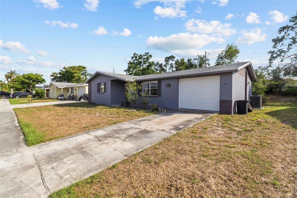 Photo of 1623 Plum Tree Road, Holiday, FL 34690 (MLS # TB8507340)