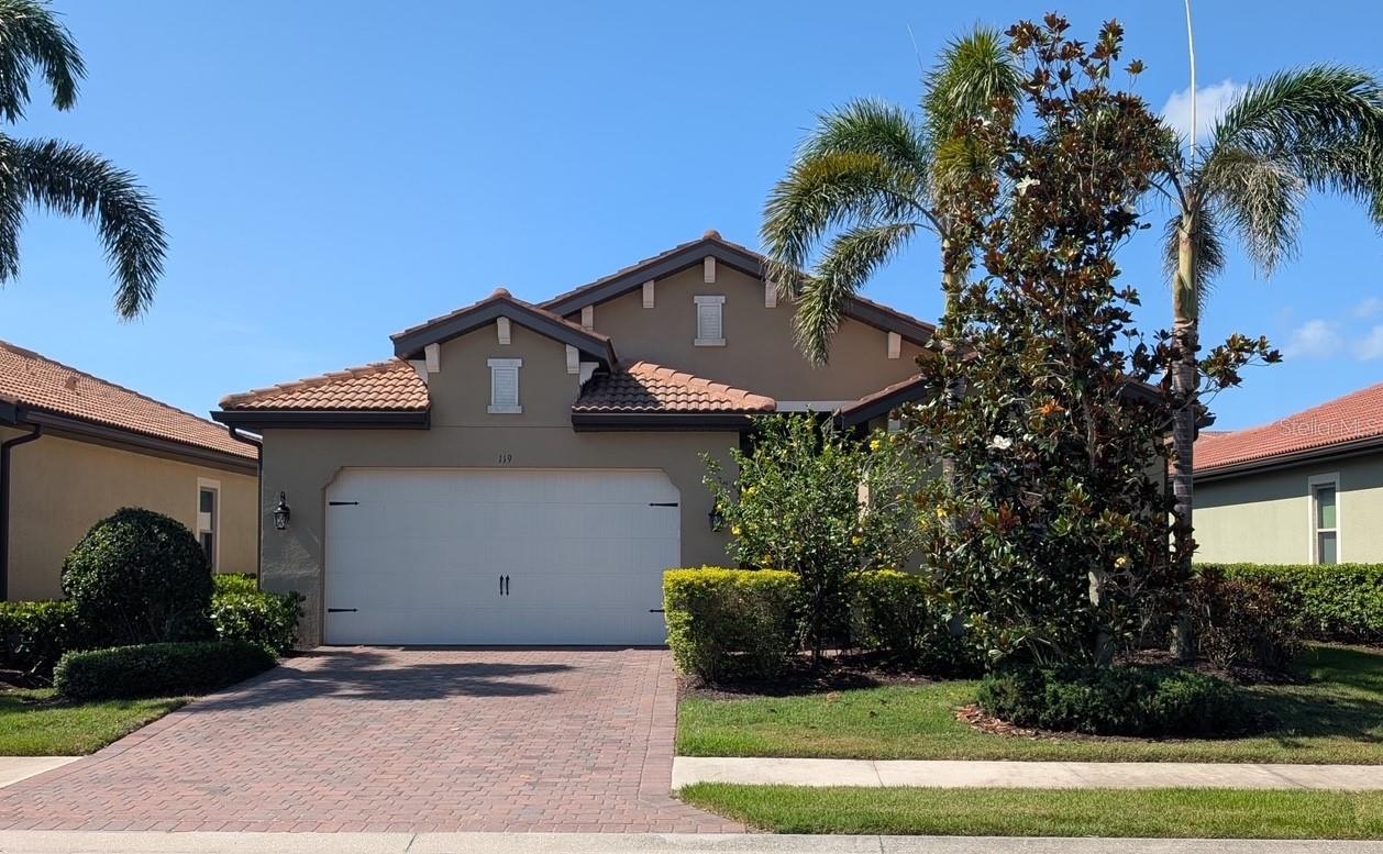 This could be your new home and lifestyle! This move-in ready pool home, located in beautiful Toscana Isles, is a 3/2 plus den/office. The home has a spacious open floor-plan, with tray ceilings in the foyer and great room, offering lots of room for get-togethers with family and friends. The open kitchen has 42-inch cabinets with under-cabinet accent lighting, granite countertops, stone tile back splash, and stainless steel appliances. The kitchen overlooks the living area, dining room, and covered lanai and features a large kitchen island, and a spacious pantry for extra storage. All main living areas are tiled and all bedrooms have been newly carpeted. The primary bedroom offers double walk-in closets and the primary bathroom includes granite countertops, dual sinks, a large walk-in frameless glass shower, a soaking tub and a private water-closet. A large set of sliding doors opens up from the great room to the large covered lanai, featuring 2 electric roll-down shutters. The lanai offers even more room for entertaining and is plumbed for an outdoor kitchen. An automated system controls the saltwater pool/spa and the upgraded LED multicolor lighting system directly from your cell phone/wireless device. The 2-car garage has pull-down stairs at the attic access, offering additional storage. Toscana Isles is an amazing, gated resort-style community that includes a Tuscan-inspired clubhouse spanning over 8,000 square feet. The clubhouse overlooks an infinity-edge pool with stunning lake views. Within the clubhouse, you’ll have access to a state-of-the-art fitness center, a billiards room with a bar, and a meeting room for social events. There are always a variety of social events planned for residents to meet neighbors in this active community. Outdoor amenities include tennis, pickleball, and bocce ball courts, a large fire pit for gatherings, and a dog park. You might also opt to go kayaking, canoeing, fishing or paddleboarding on one of the picturesque lakes. This home is conveniently located to the clubhouse. Toscana Isles is near I-75, and is only minutes from the Sarasota Memorial Hospital-Venice Campus. This home is available for a quick closing, and for your private viewing today!
