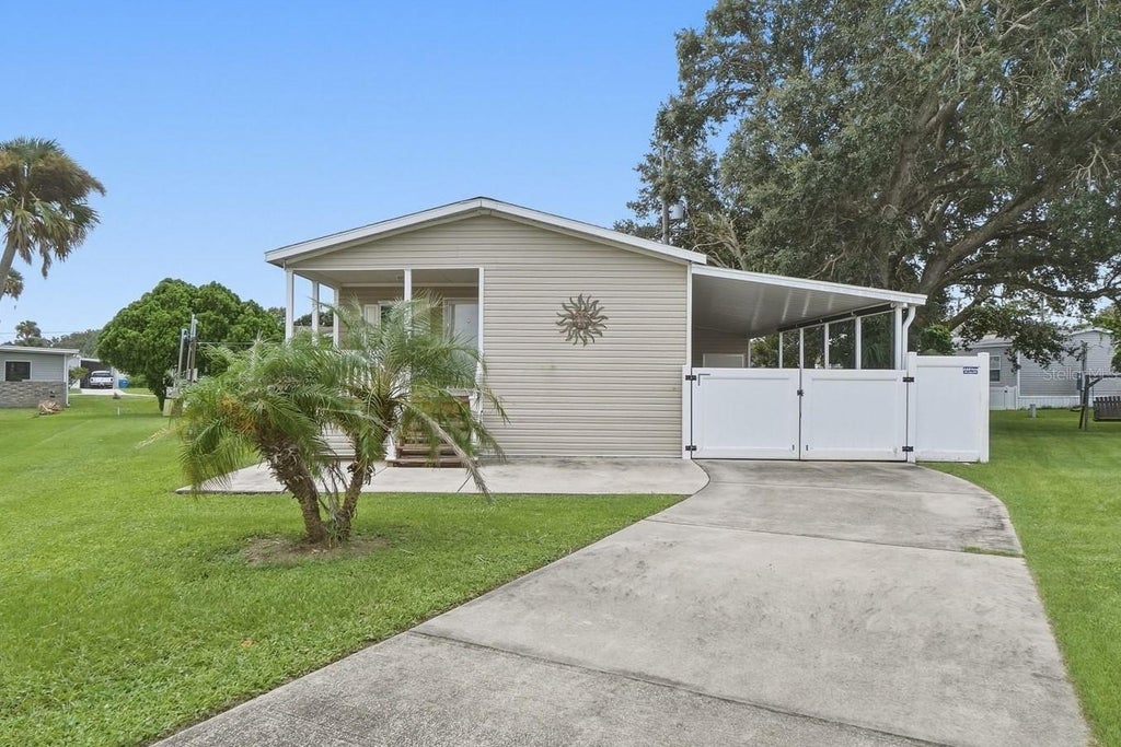 Photo of 4340 Cypress Way, Edgewater, FL 32141 (MLS # O6444639)
