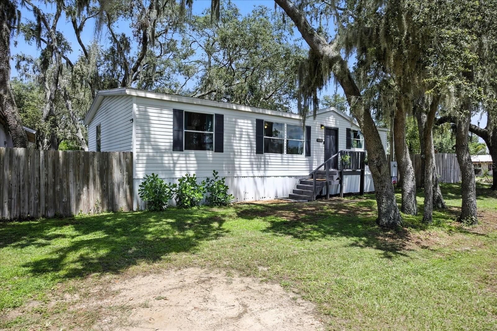 Unlock the possibilities with this charming home in the vibrant heart of Riverview, FL! This spacious double-wide manufactured home combines comfort and opportunity, whether you're looking to settle in or envision your dream home on this generous corner lot (82 feet wide x 105 feet deep).
With 3 large bedrooms and 2 bathrooms, you'll enjoy ample space for relaxation and everyday living. The open-concept kitchen is perfect for entertaining, making the most of over 1,300 square feet of inviting living space.
The property also boasts a large, detached workshop with electricity—ideal for pursuing hobbies or storing equipment. Whether you decide to personalize this home or embark on creating something new, this property serves as a blank slate ready for your unique touch. Don't let this incredible chance pass you by schedule a viewing today and explore the potential that awaits!