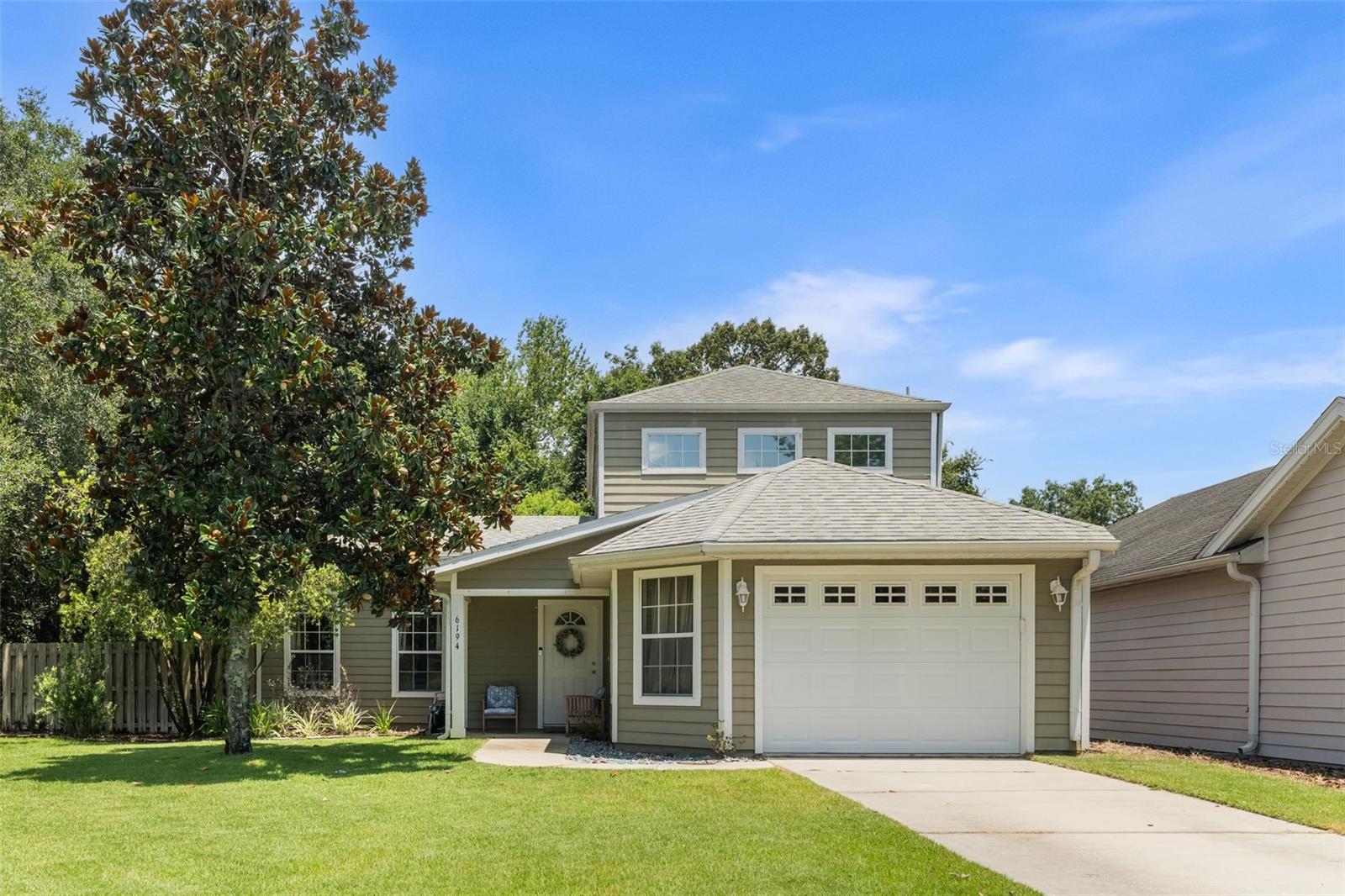 Welcome to the only two-story home in the gated Creekside Villas community, nestled within the scenic Turkey Creek neighborhood. This exceptional property sits on a rare lot with no neighbors to the west or rear—offering serene views of mature landscaping, private wooded surroundings, and a peaceful catch and release stocked pond. It's also one of the few homes in the neighborhood with a privacy fenced yard! Inside, the home is filled with natural light and picturesque views from every room. The main level features the spacious primary suite, an updated kitchen with custom cabinetry, inviting living areas, and a generously sized laundry room with sink and storage. Upstairs, you'll find two large bedrooms and a shared full bathroom. Additional updates include new landscaping and a front yard irrigation system. All appliances are approximately five years old. A golf cart and a second refrigerator (located in the garage) are included with the sale. Turkey Creek, home to one of Alachua County's few public golf courses, also boasts an on-site restaurant that hosts weekly events like live music, karaoke, and trivia nights. Residents additionally enjoy a wide range of private amenities, including tennis and pickleball courts, soccer fields, a large swimming pool, clubhouse, and playground—all with a low HOA. This is a rare opportunity to own a one-of-a-kind home in one of Alachua County’s most amenity-rich neighborhoods! Book your appointment today before this rare gem is gone!