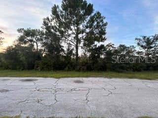 Photo of 818 Bougainville Drive, Indian Lake Estates, FL 33855 (MLS # TB8537688)